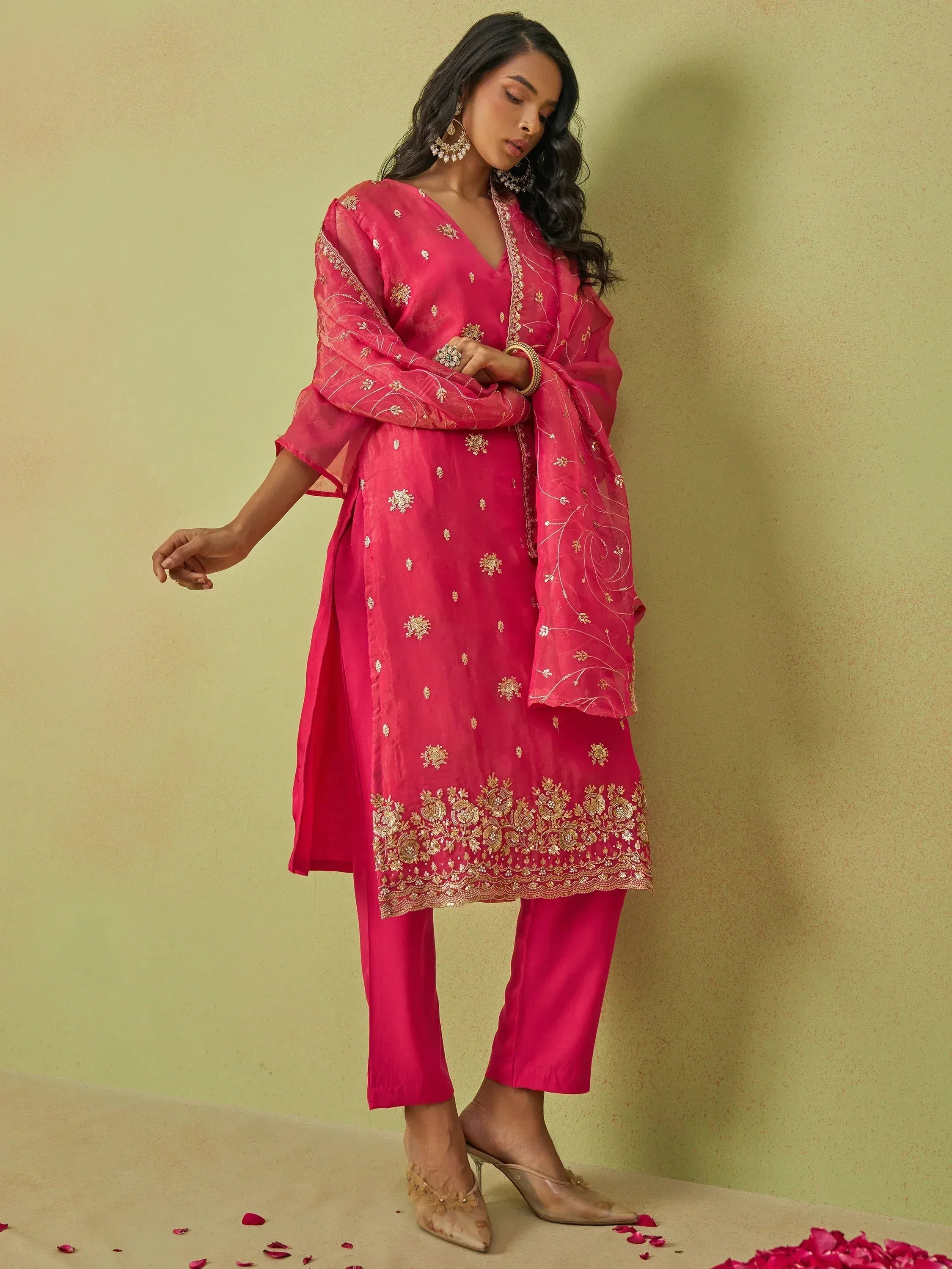 Pink embroidered salwar kameez with gold detailing, perfect for Indian ethnic wear occasions
