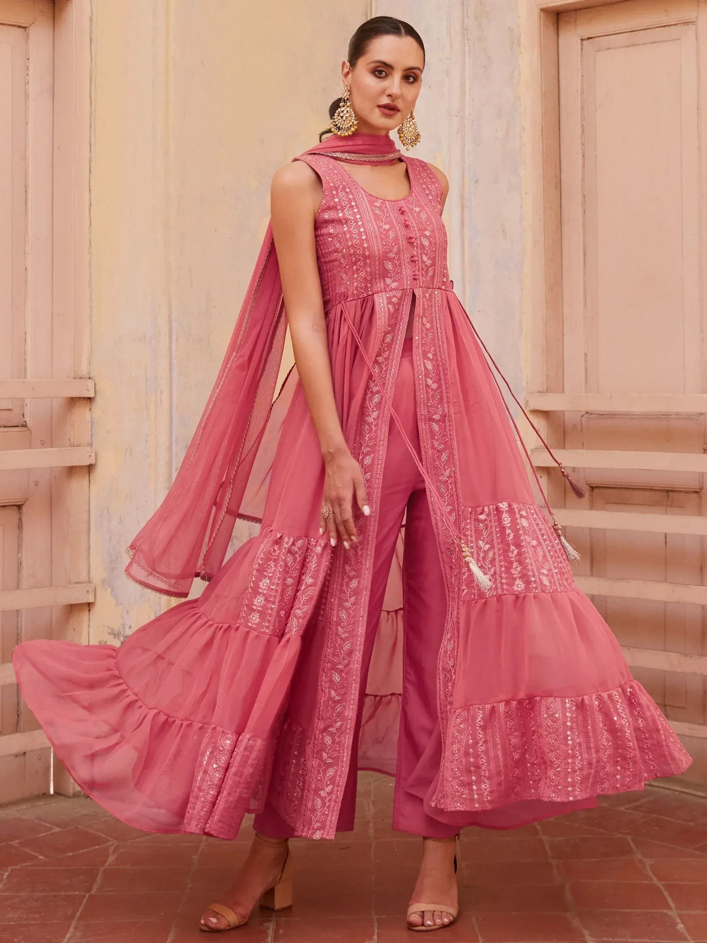 Pink embroidered ethnic anarkali suit with palazzo pants and dupatta, perfect for Indian weddings or festive occasions.