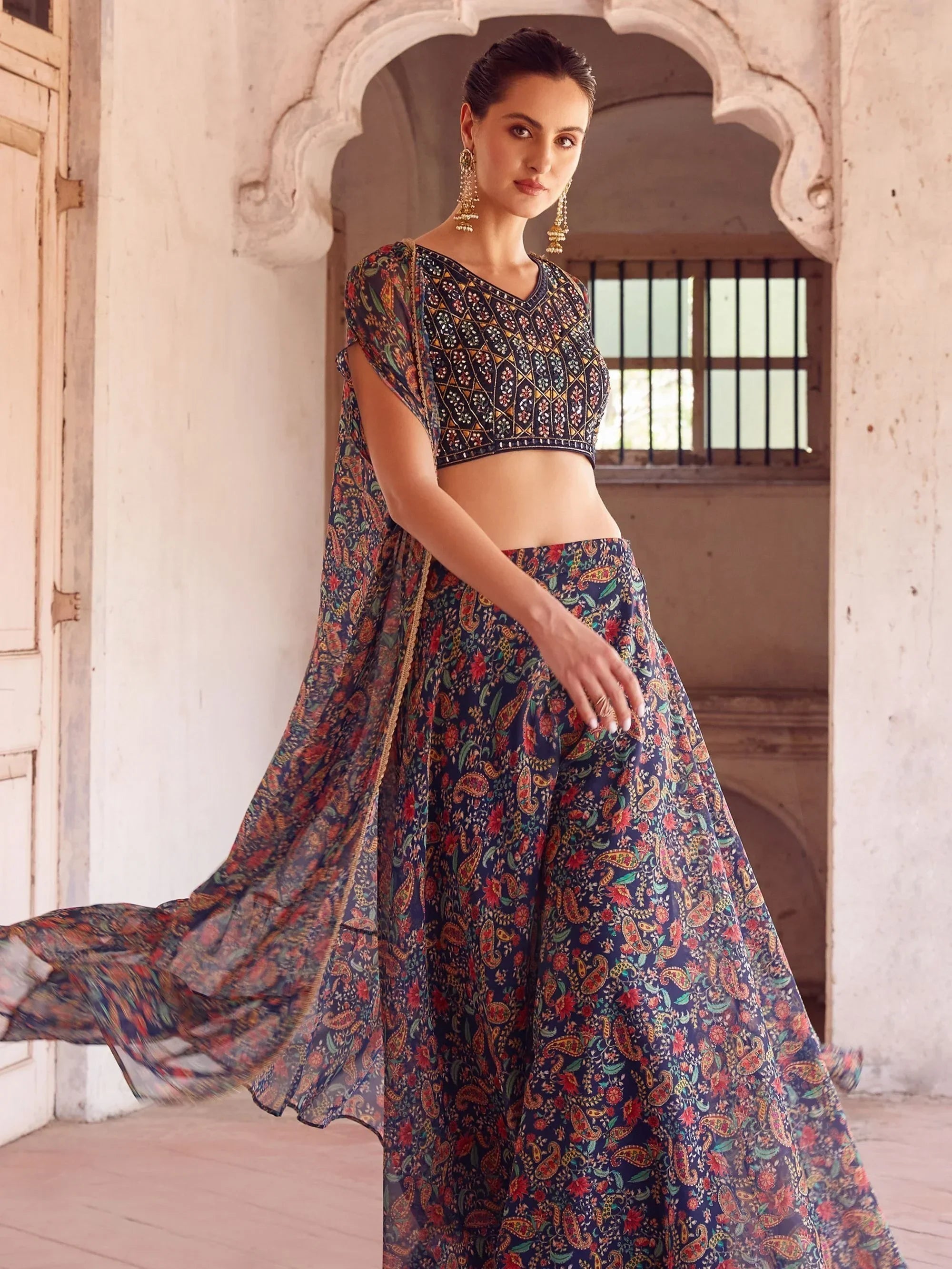 Woman in floral print lehenga choli with dupatta, traditional Indian ethnic wear