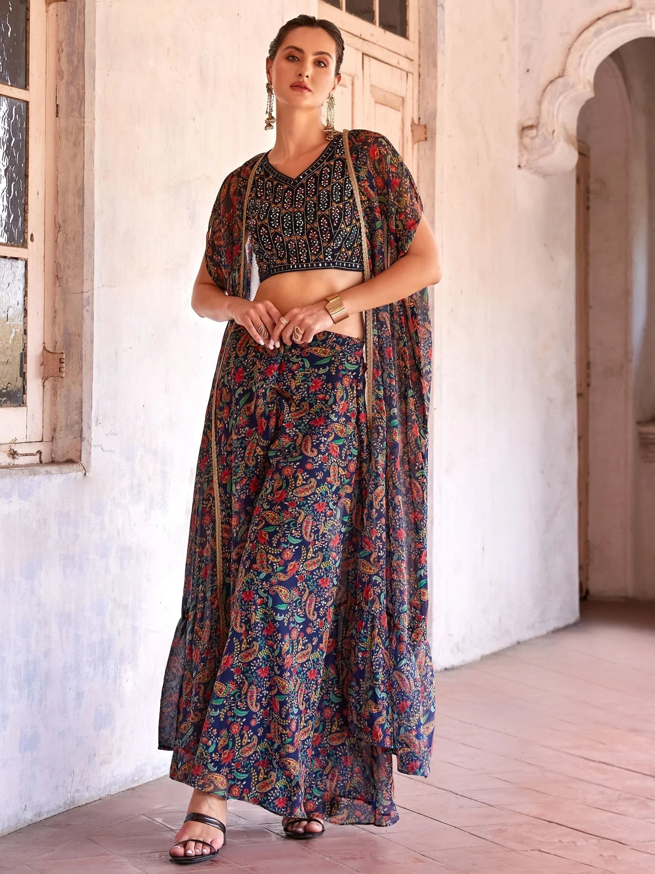 Woman wearing navy blue floral printed lehenga choli with dupatta, traditional Indian attire