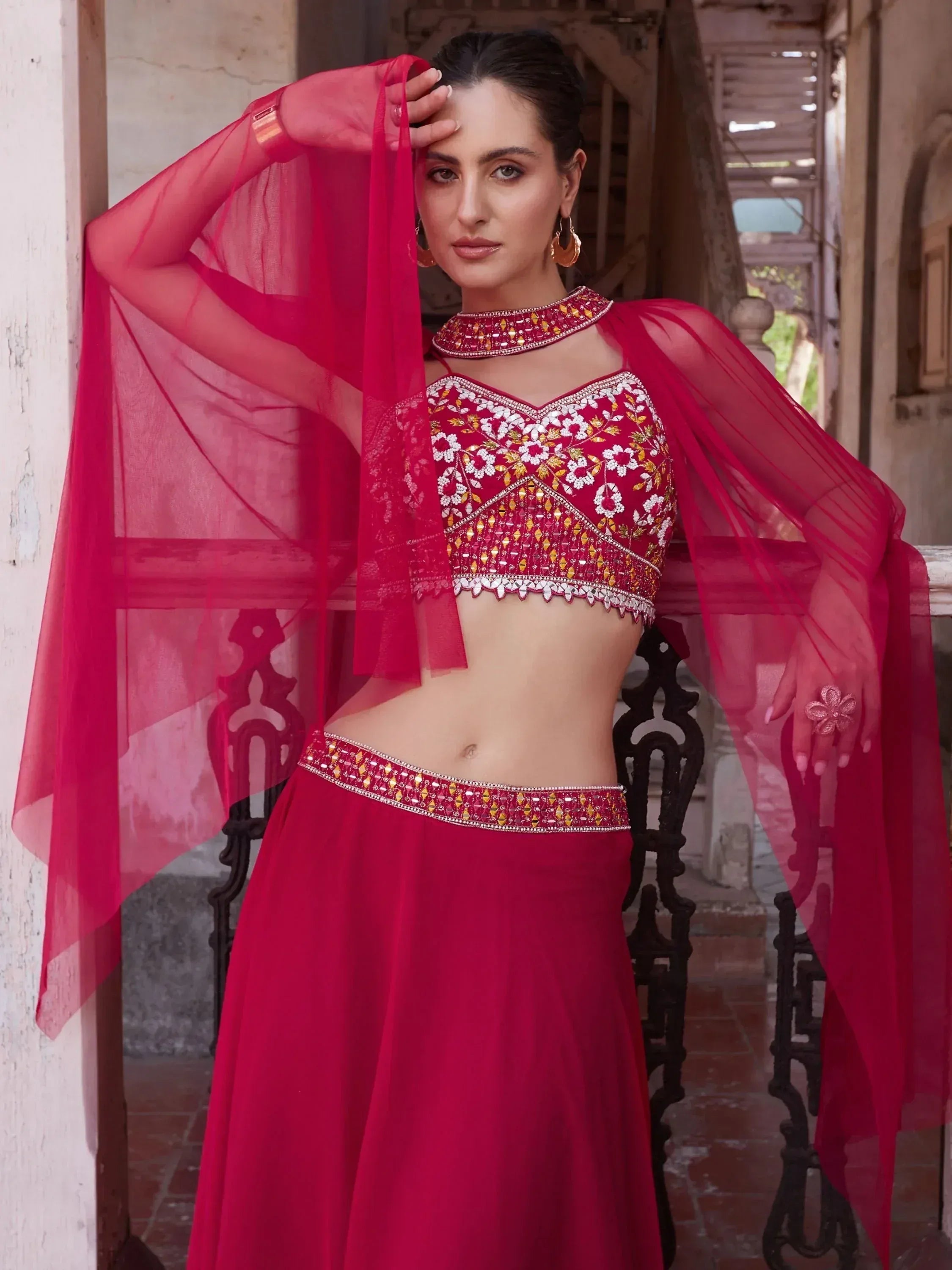 Red embroidered lehenga choli with sheer dupatta, perfect for Indian ethnic wear occasions