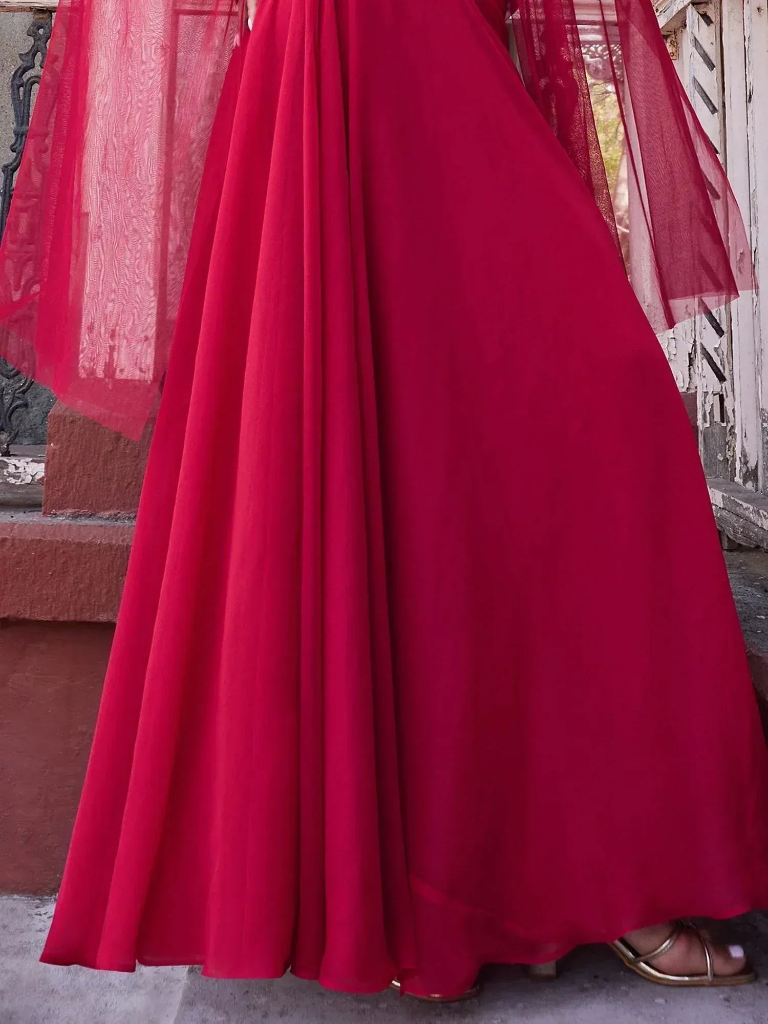 Red ethnic gown with sheer dupatta, perfect for Indian weddings and festive occasions
