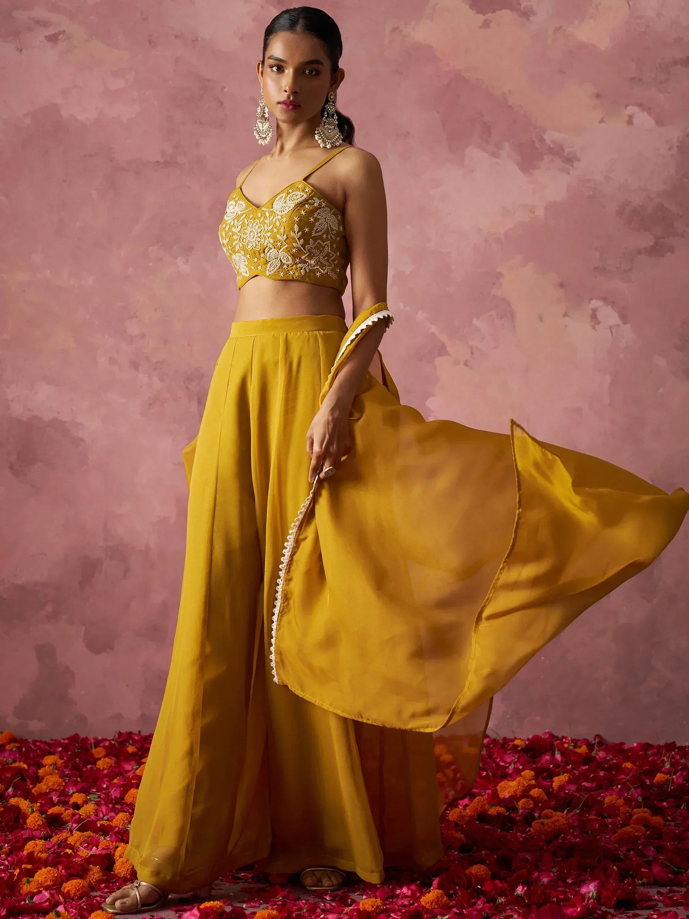Mustard yellow embroidered lehenga choli with floral detailing, perfect for Indian ethnic wear occasions