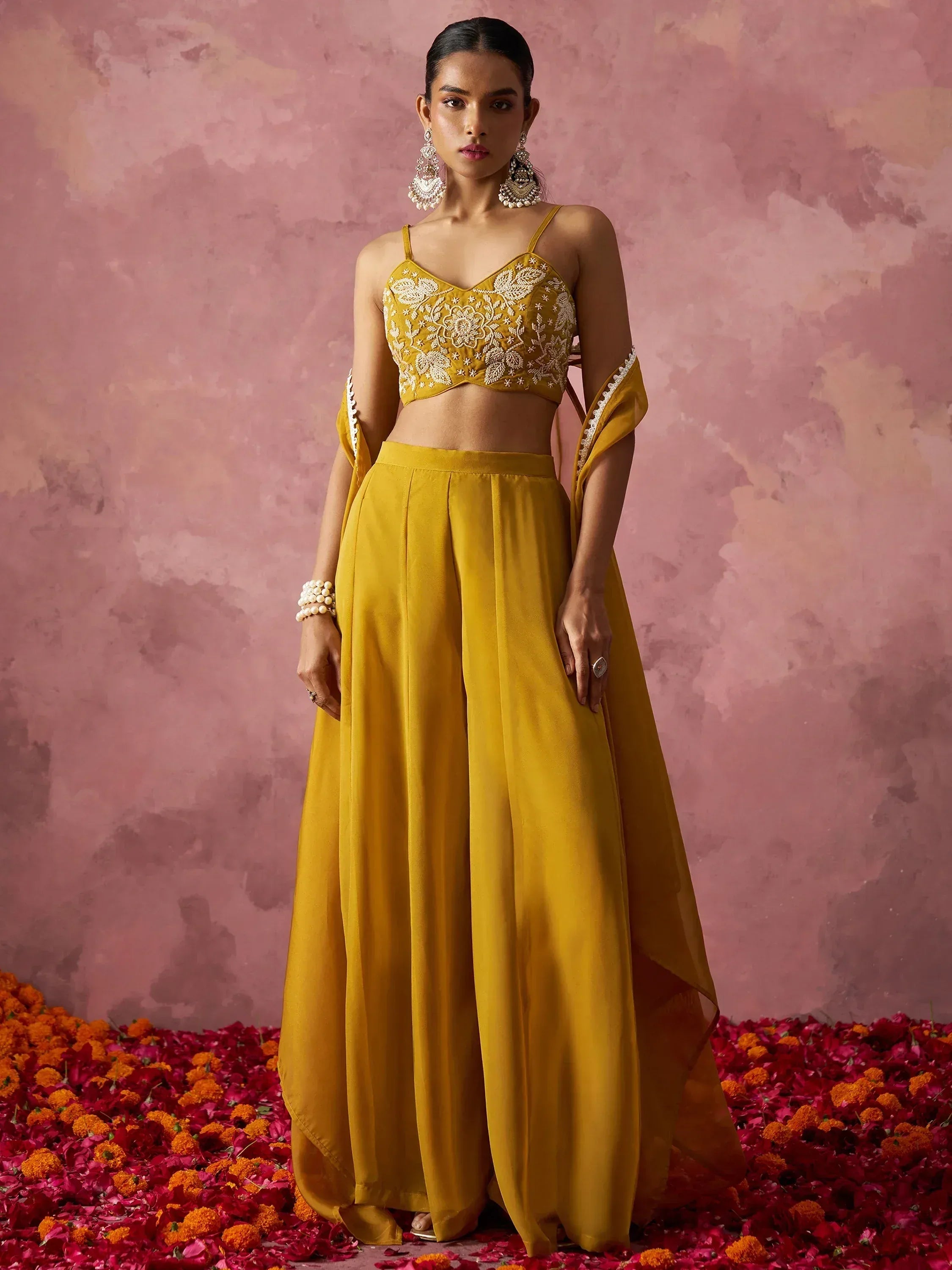 Mustard yellow embroidered lehenga choli with floral detailing, perfect for Indian ethnic wear occasions