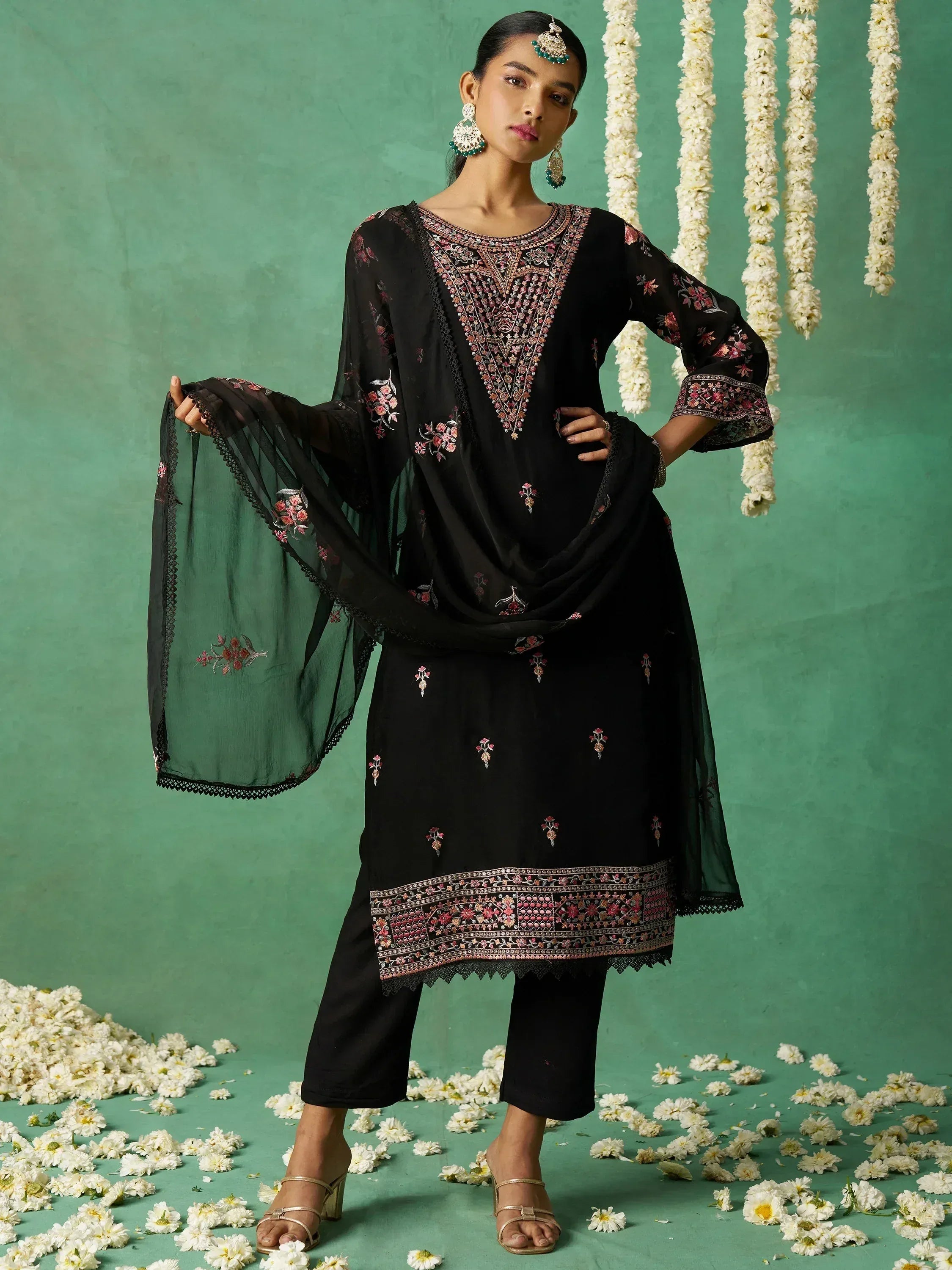 Black embroidered salwar kameez with floral detailing, perfect for Indian ethnic wear occasions.