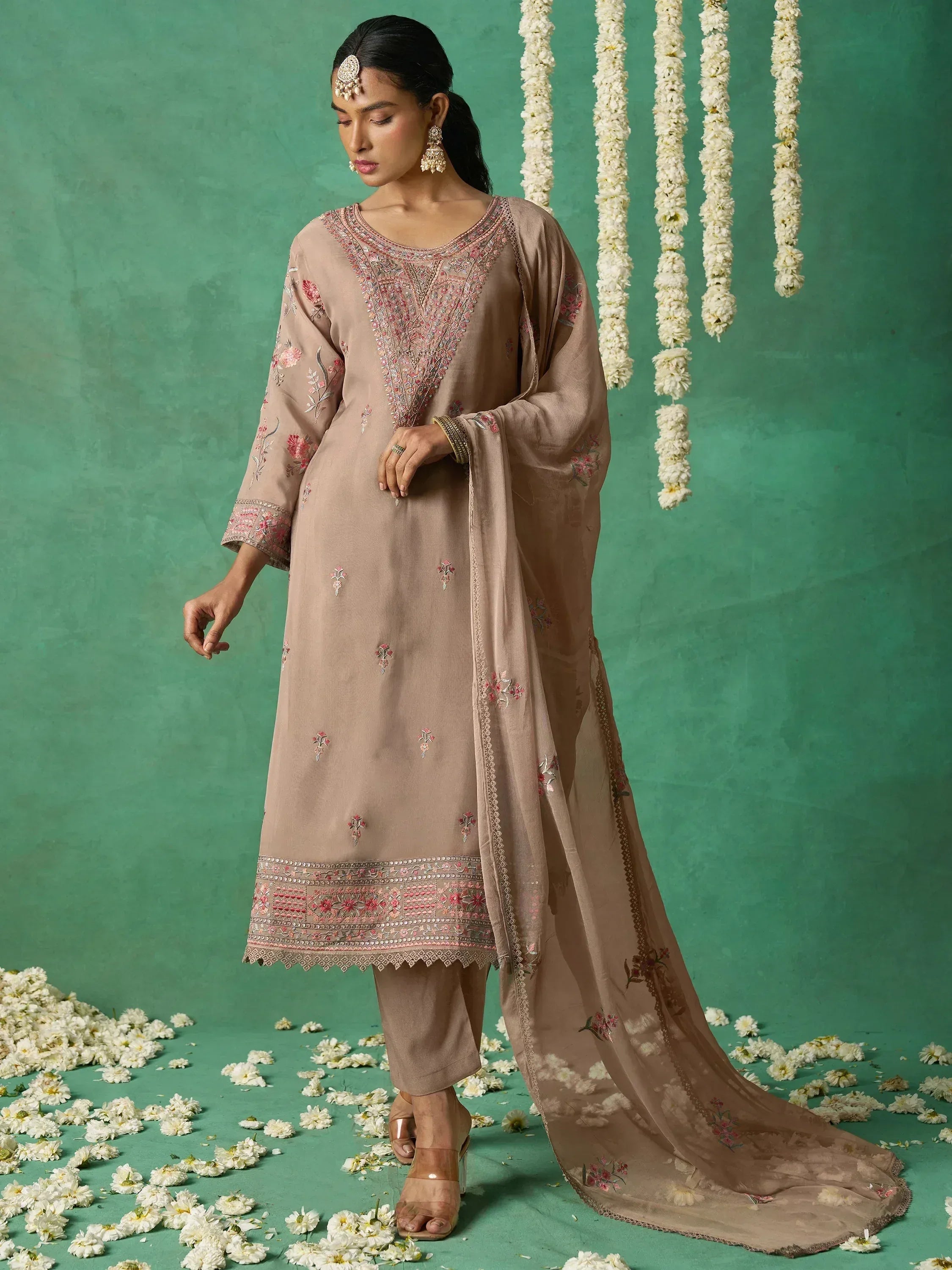 Elegant beige embroidered salwar kameez with floral motifs, perfect for Indian ethnic wear occasions.