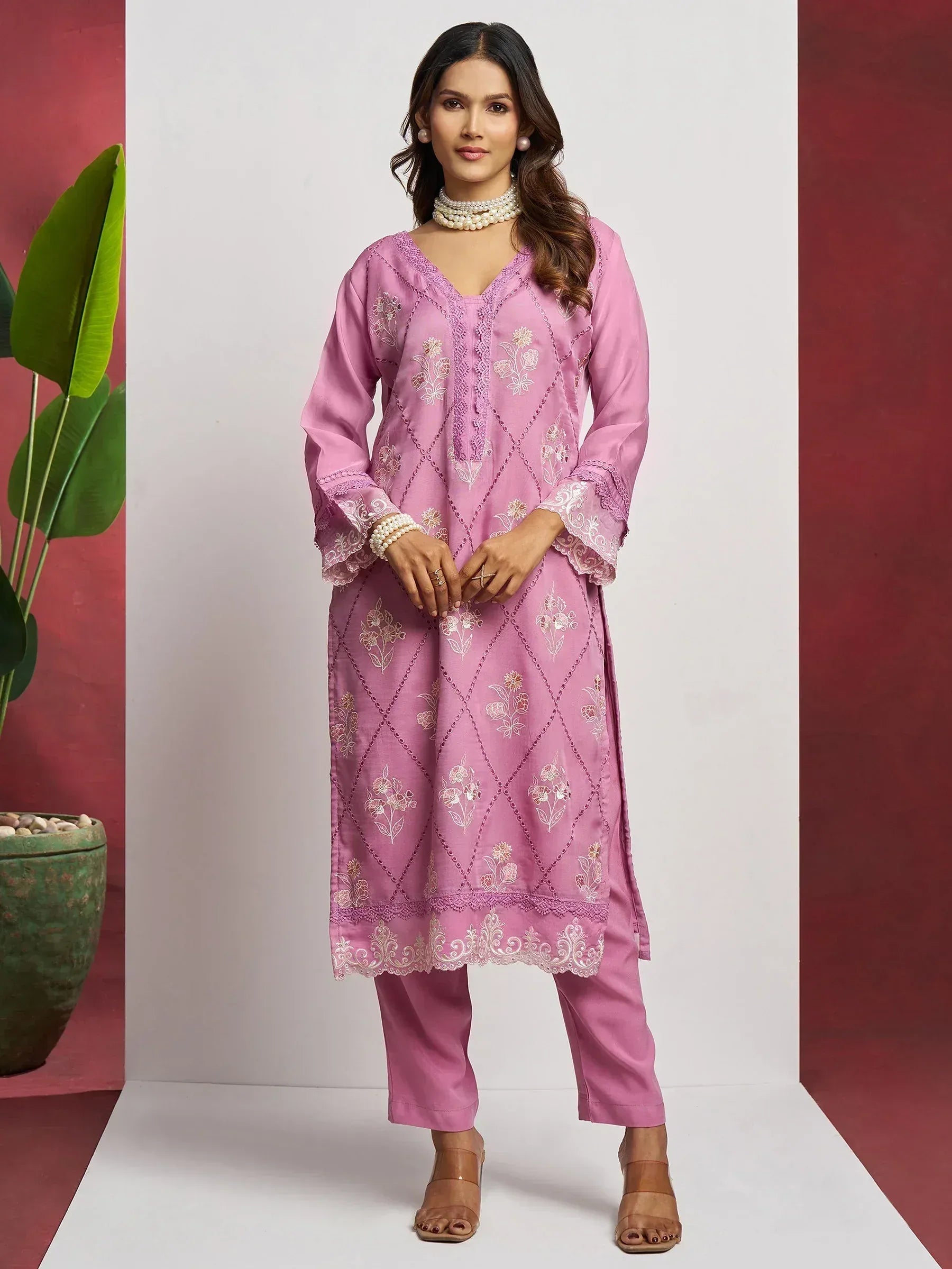 Pink embroidered salwar kameez with floral lace detailing, perfect for Indian ethnic wear occasions