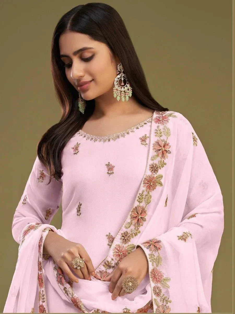 Pink embroidered salwar kameez with floral detailing, perfect for ethnic occasions
