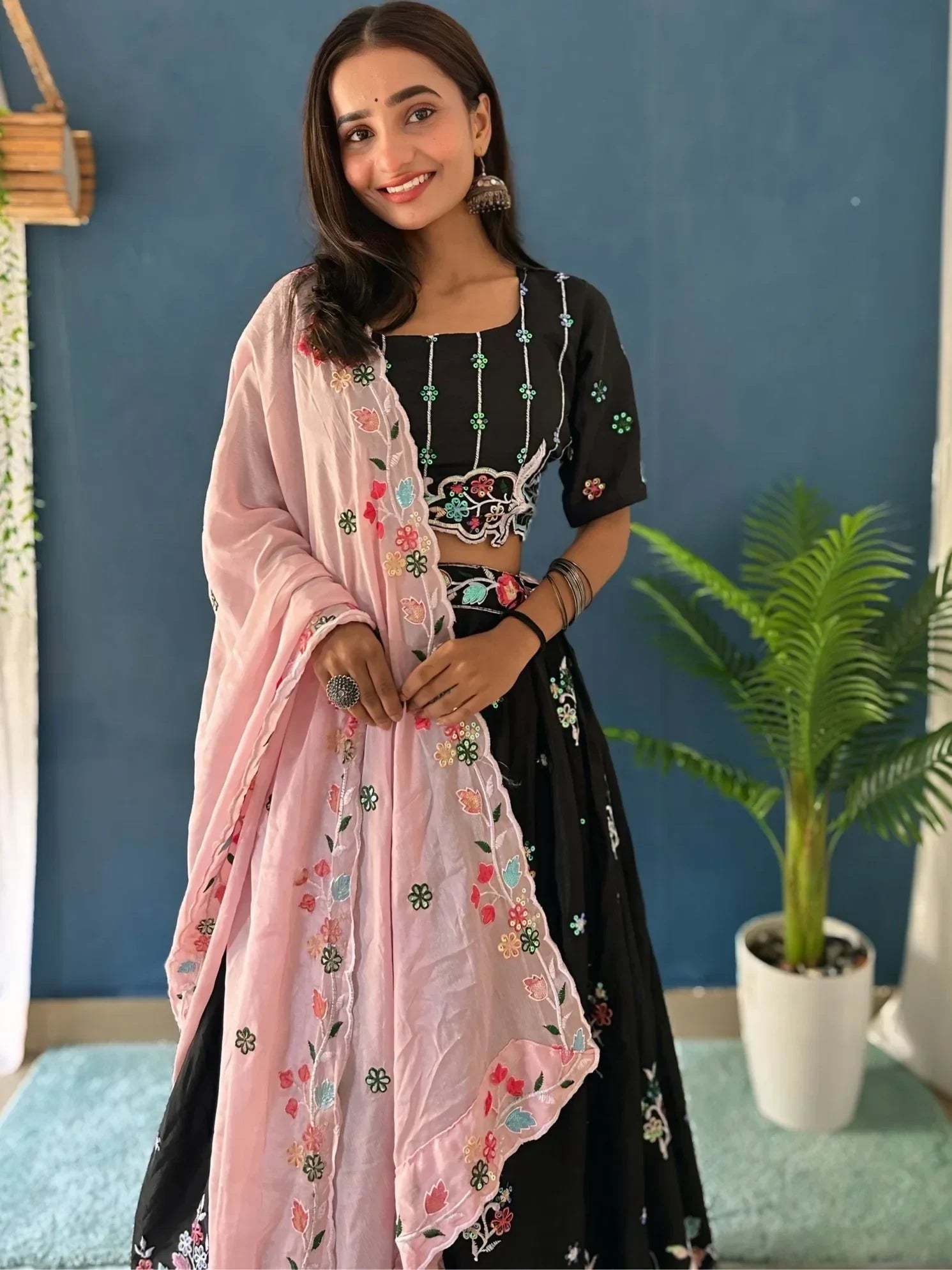 Black embroidered lehenga choli with pink floral dupatta, Indian ethnic wear for women