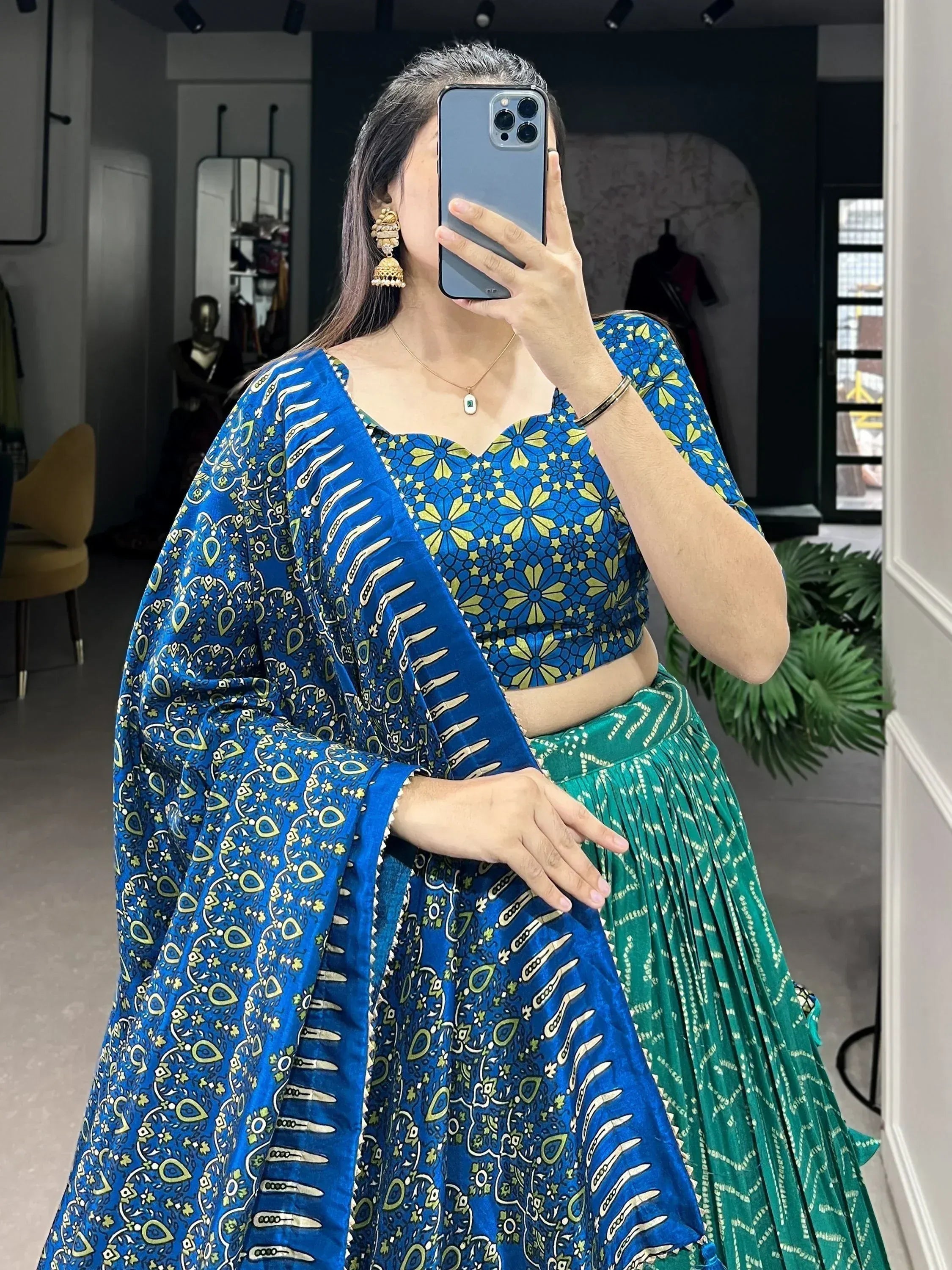 Blue and green printed lehenga choli with floral blouse, perfect for Indian ethnic wear occasions