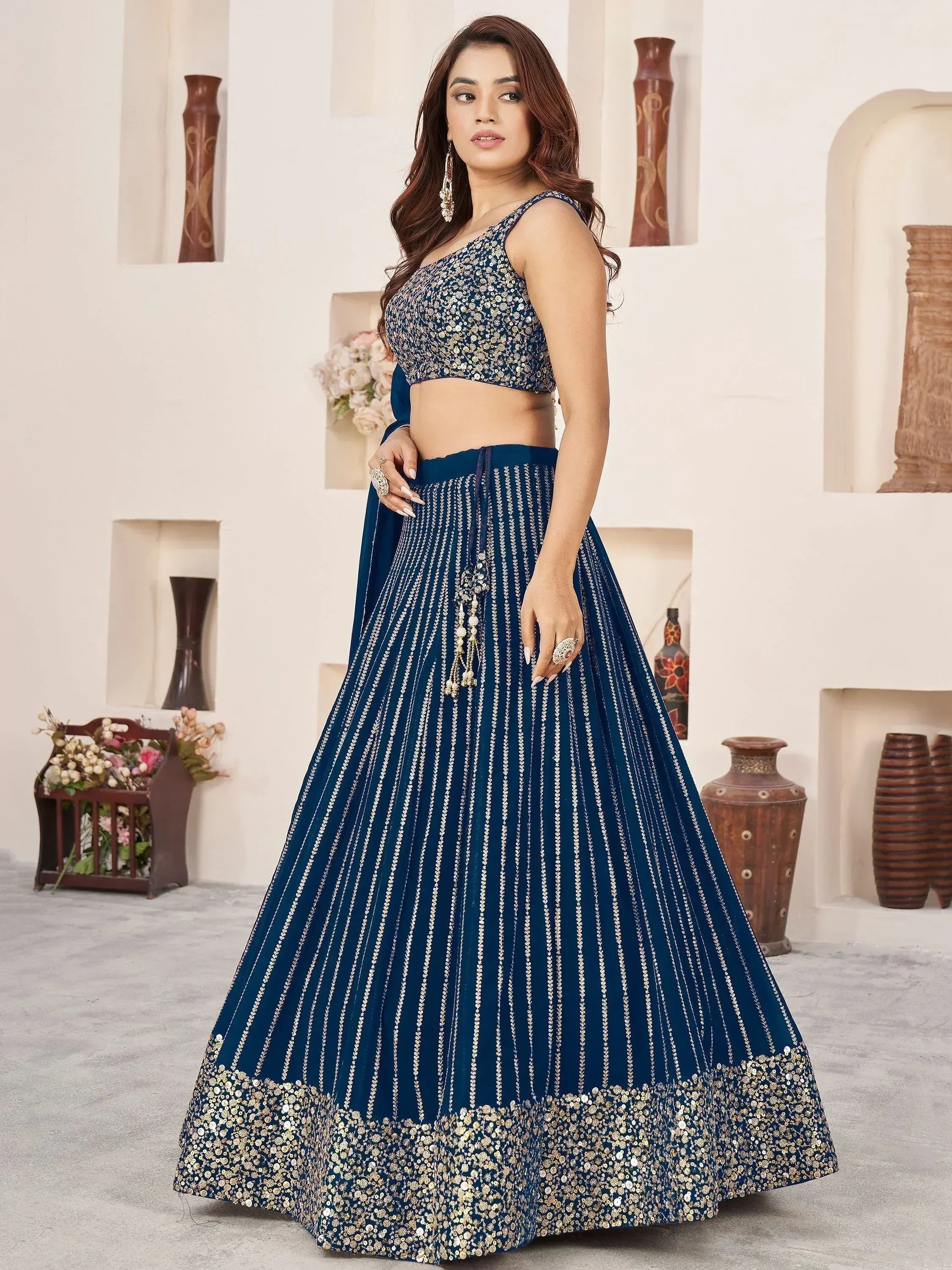Navy blue designer lehenga choli with gold sequin work, perfect for Indian ethnic wear events