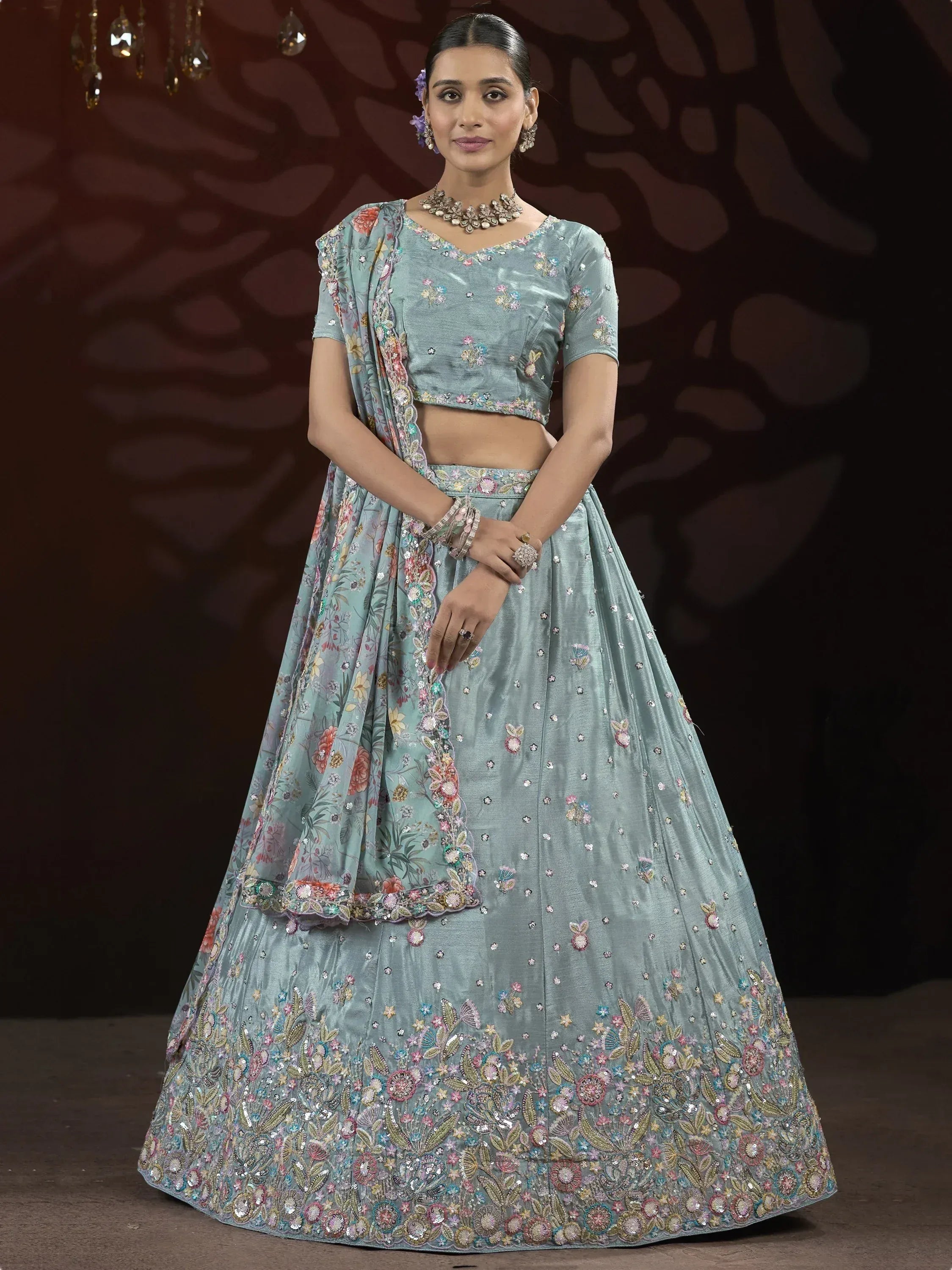 Light blue embroidered lehenga choli with floral dupatta, perfect for Indian weddings and festive occasions.