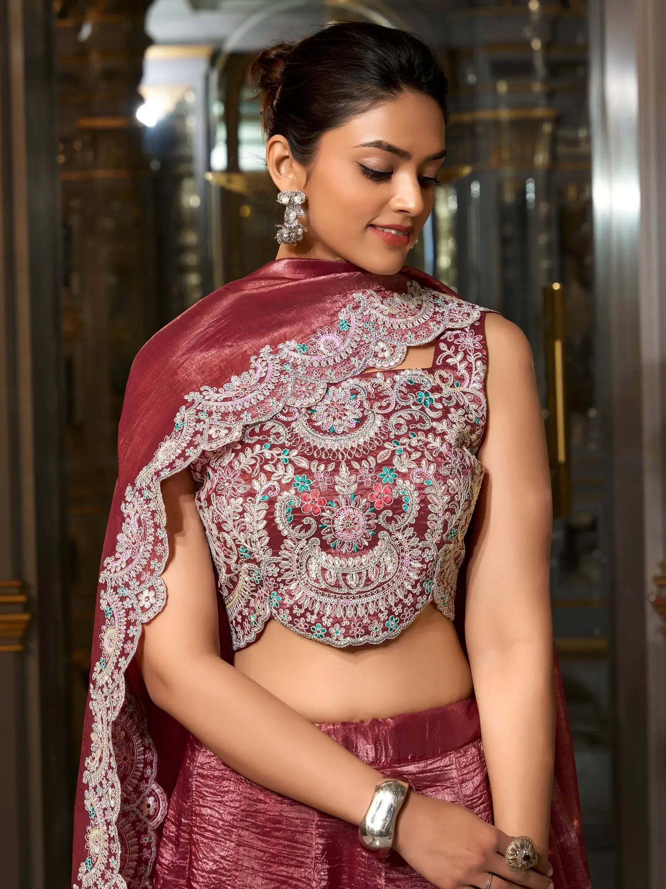 Maroon embroidered lehenga choli with floral zari work, perfect for Indian ethnic wear events