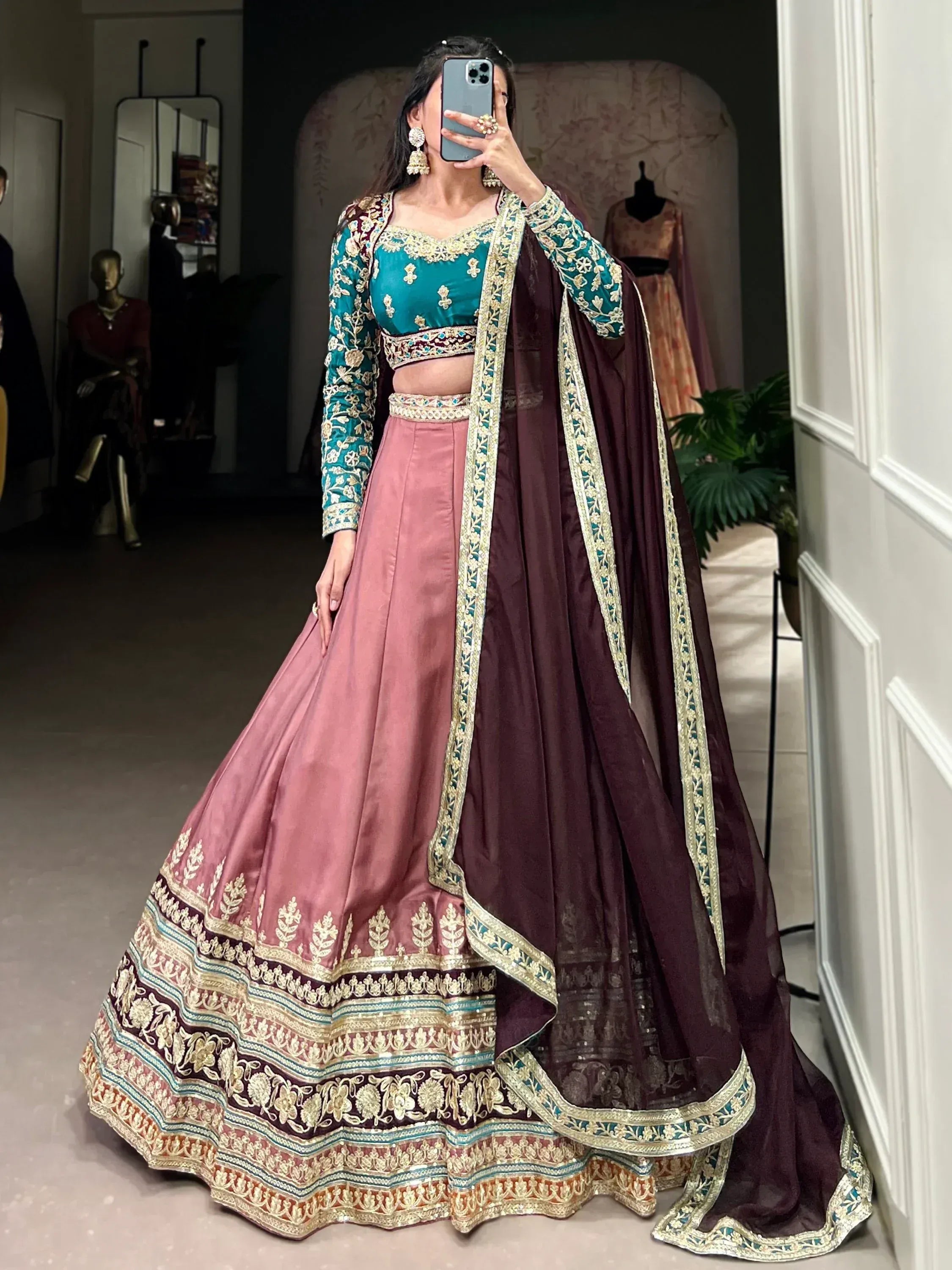 Teal and pink embroidered lehenga choli with maroon dupatta, Indian ethnic wear for weddings