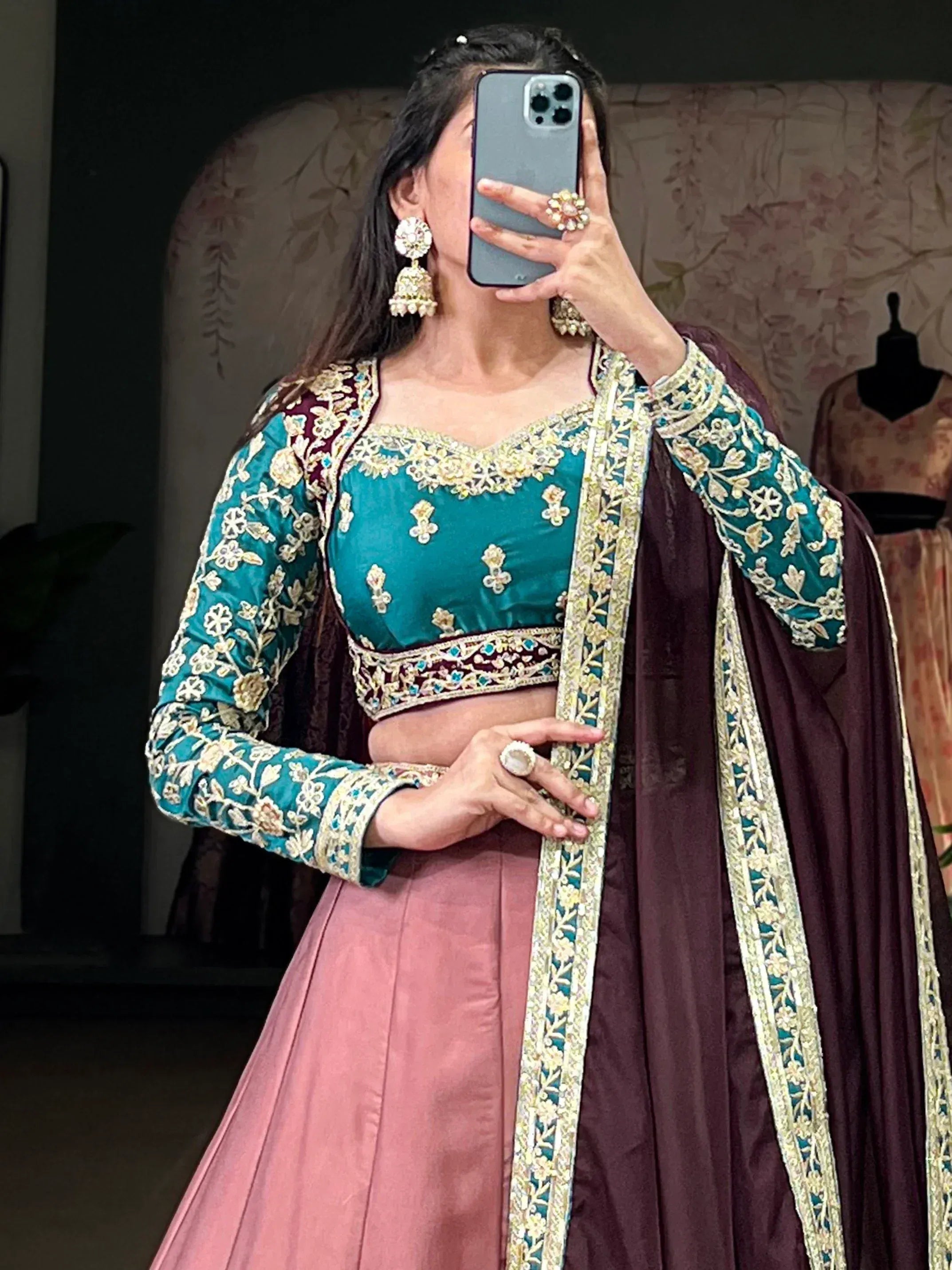 Teal and maroon embroidered lehenga choli with gold detailing, perfect for Indian ethnic wear occasions.