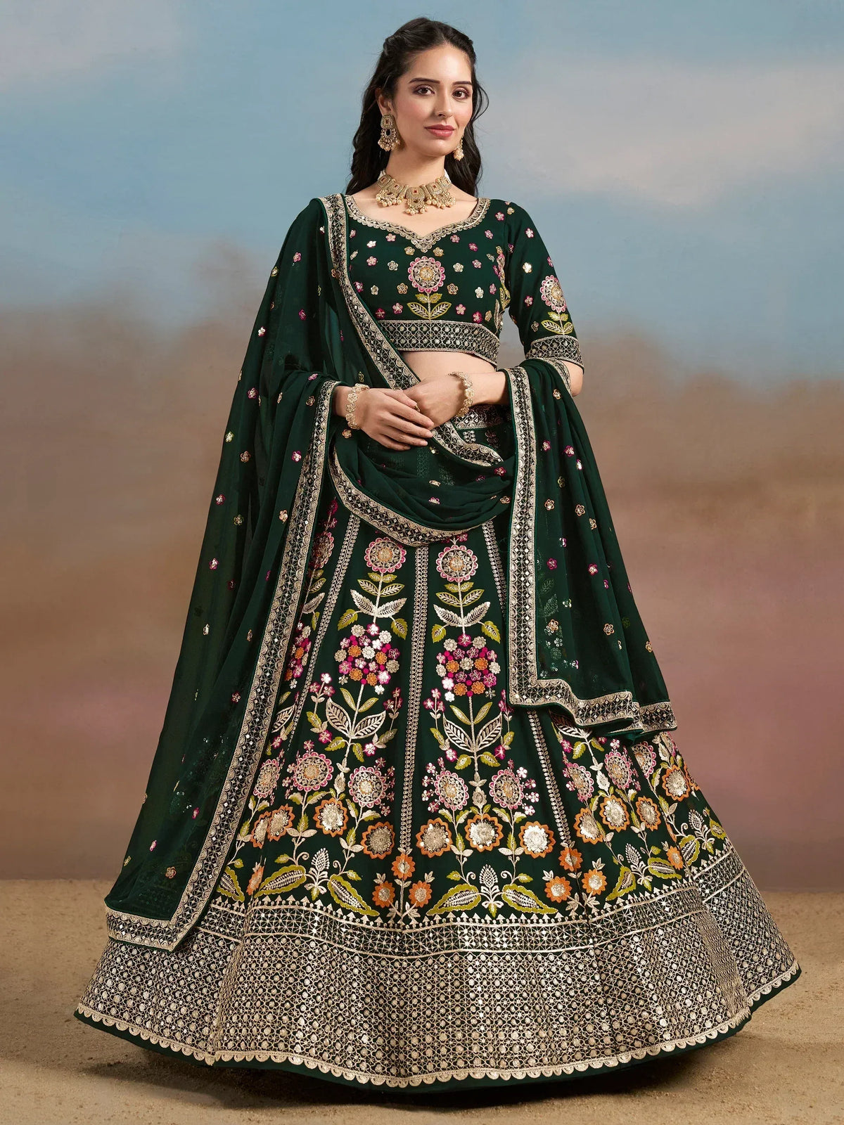 Emerald green designer lehenga choli with floral embroidery and gold detailing for Indian ethnic wear