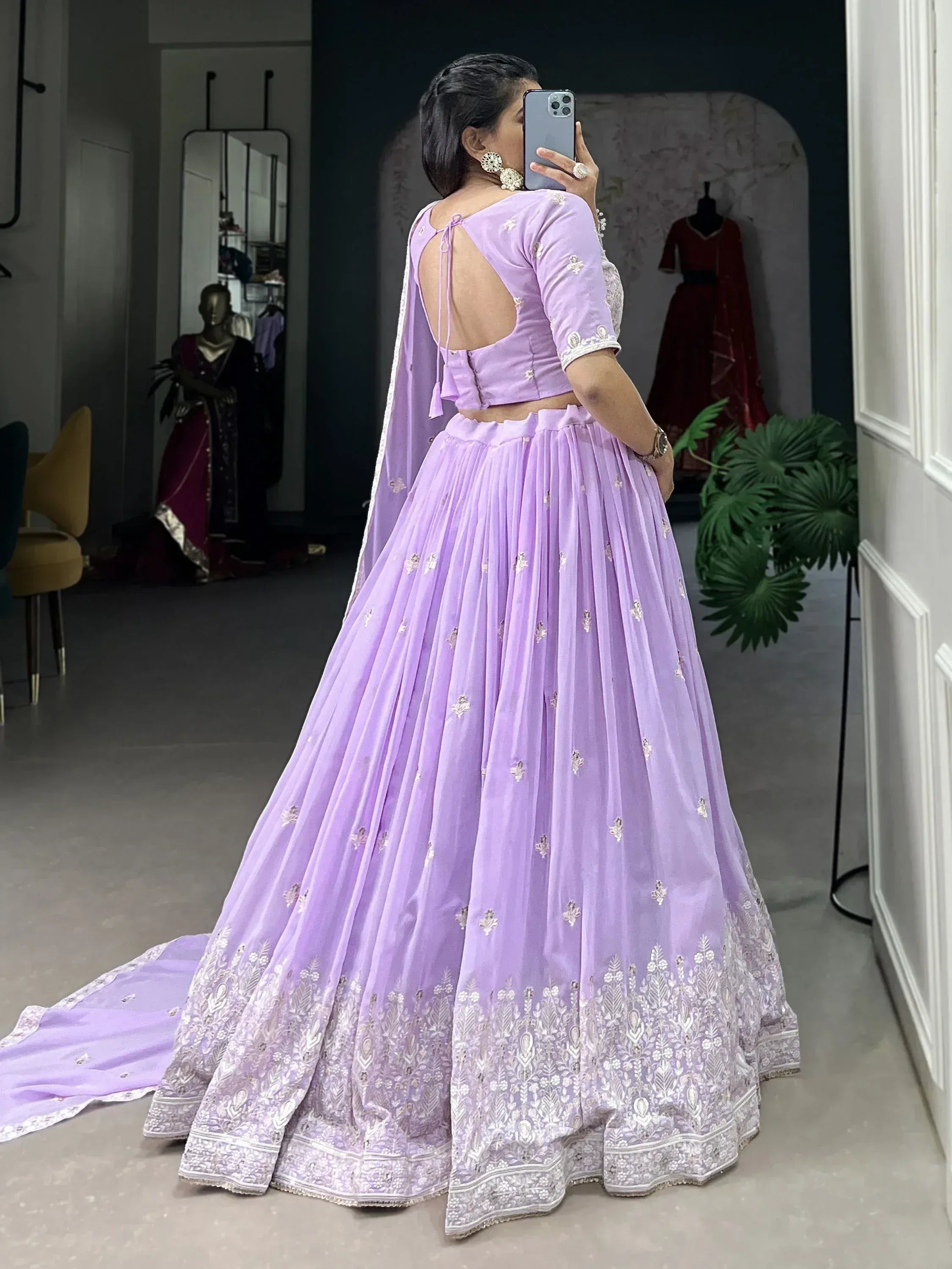 Lavender designer lehenga choli with backless blouse and floral embroidery, perfect for Indian ethnic wear