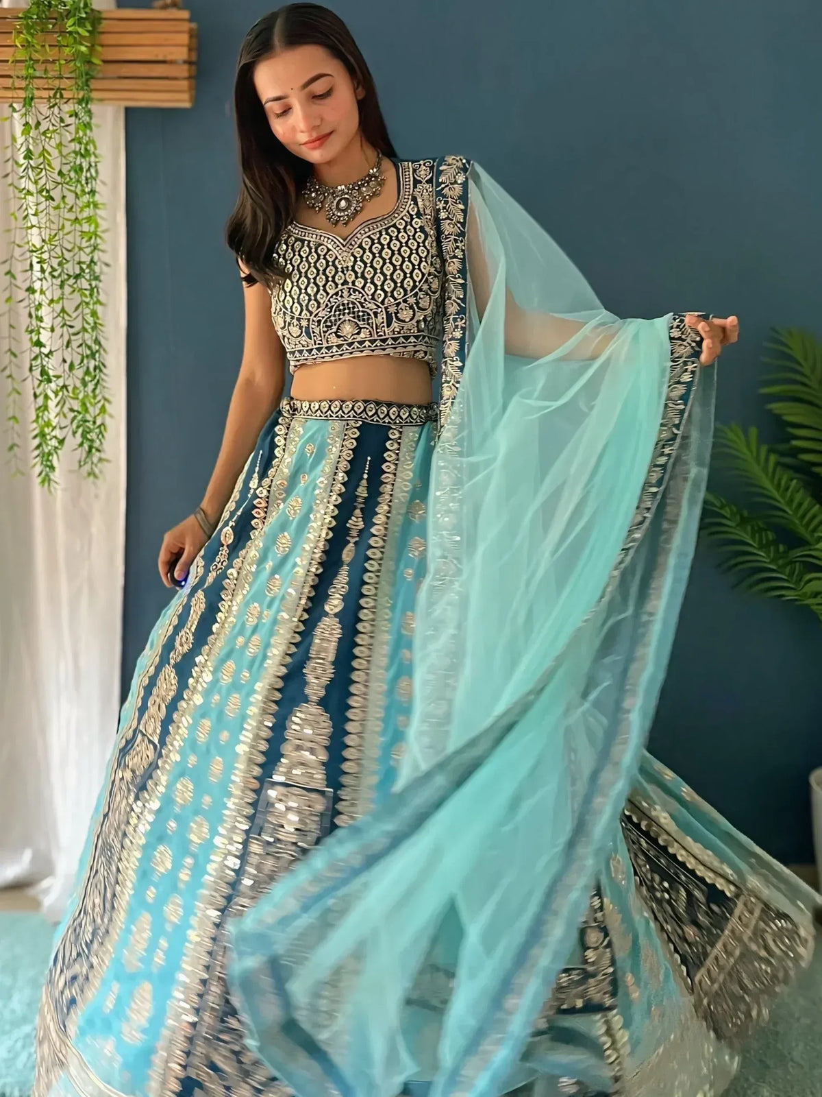 Blue and silver embroidered lehenga choli with sheer dupatta, perfect for Indian ethnic wear events