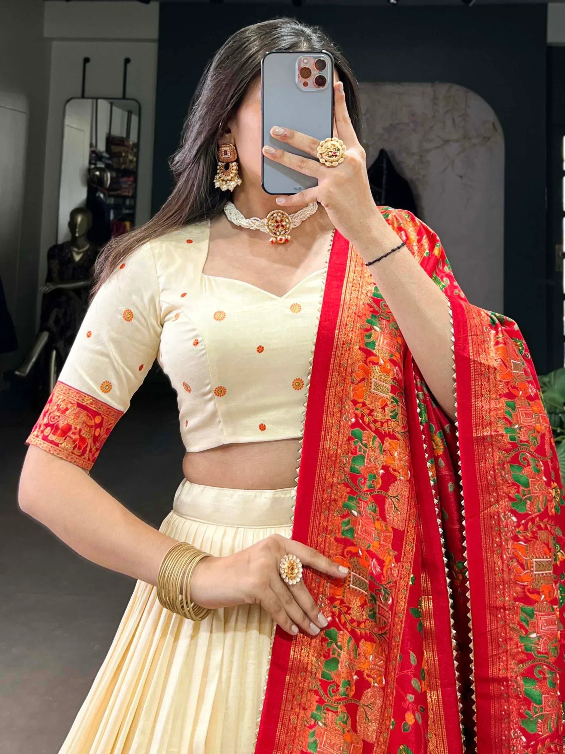 Cream lehenga choli with red embroidered dupatta, traditional Indian ethnic wear for women
