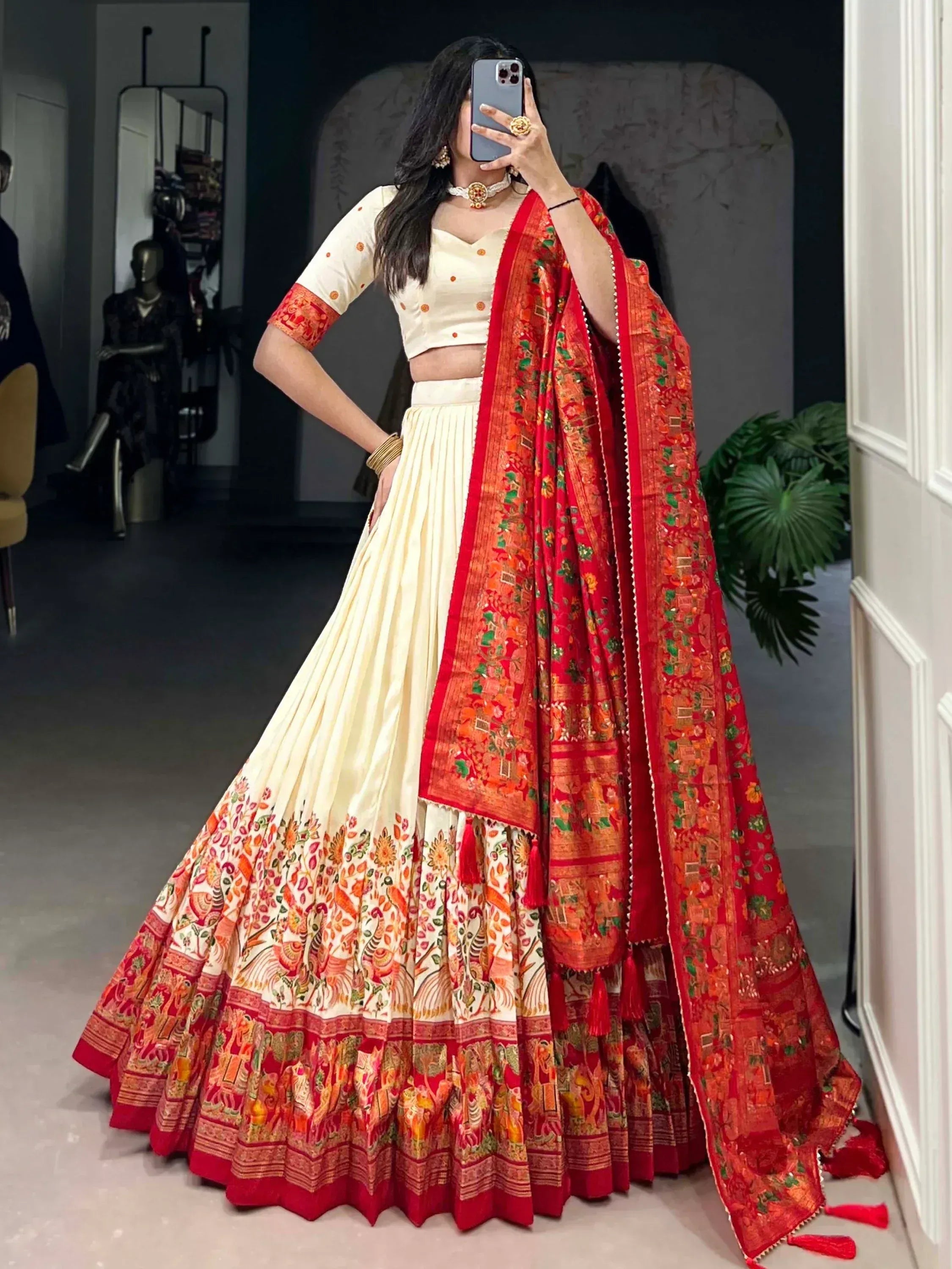 Cream and red printed lehenga choli with floral border and matching dupatta, ethnic Indian wear