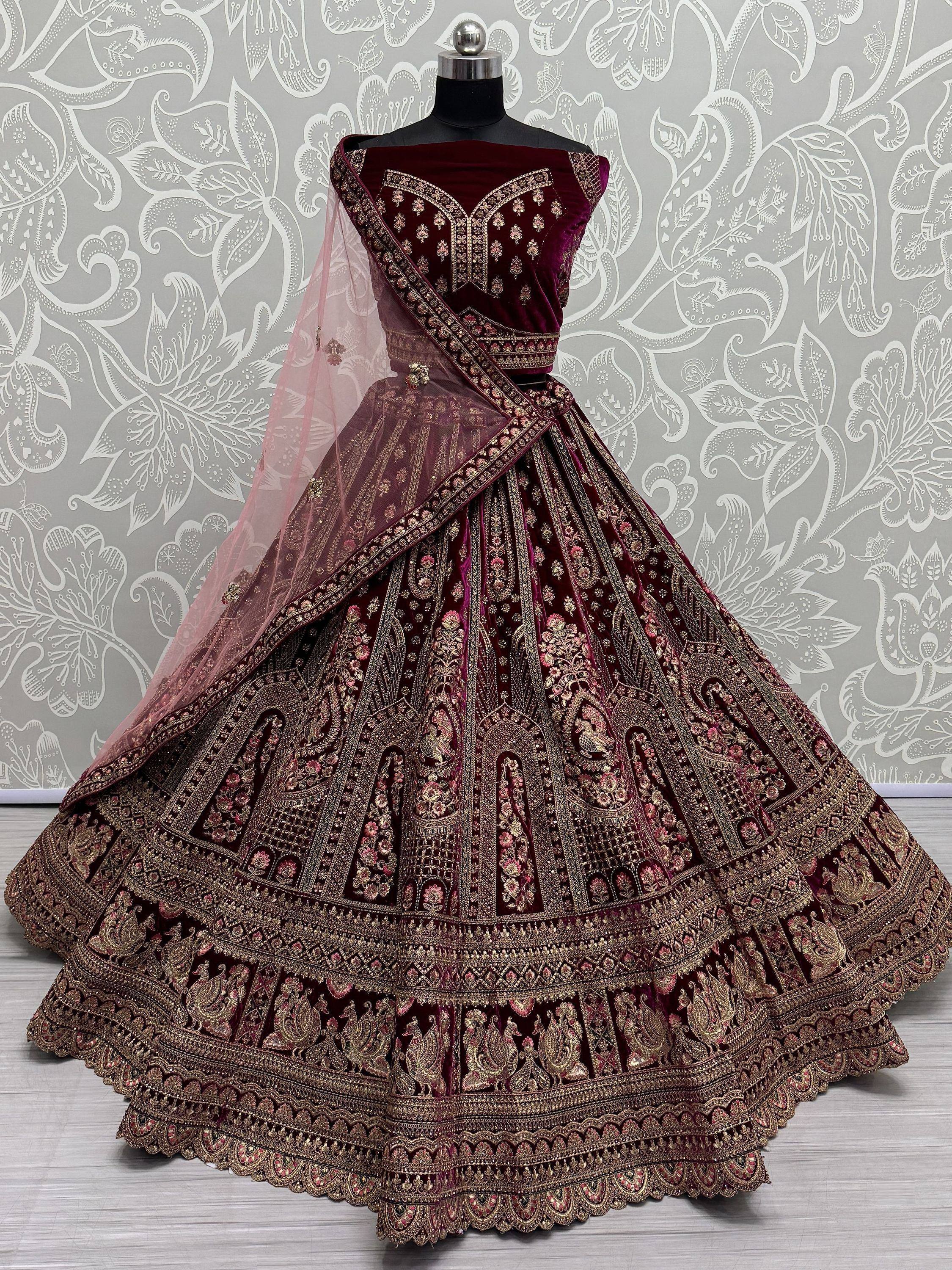 Burgundy velvet designer lehenga choli with heavy gold embroidery and sheer dupatta, Indian ethnic wear