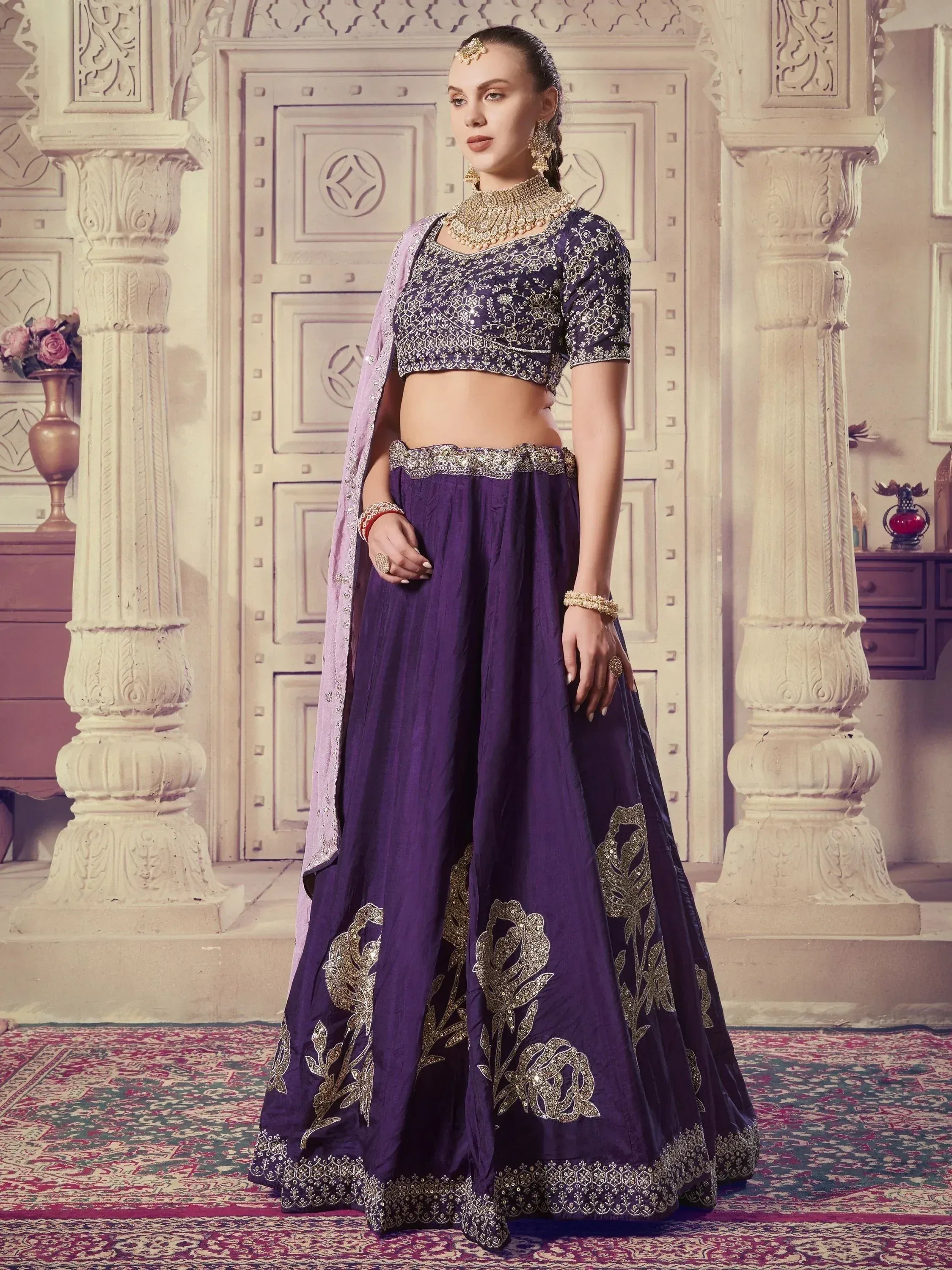 Purple embroidered lehenga choli with gold floral work, perfect for Indian ethnic wear events