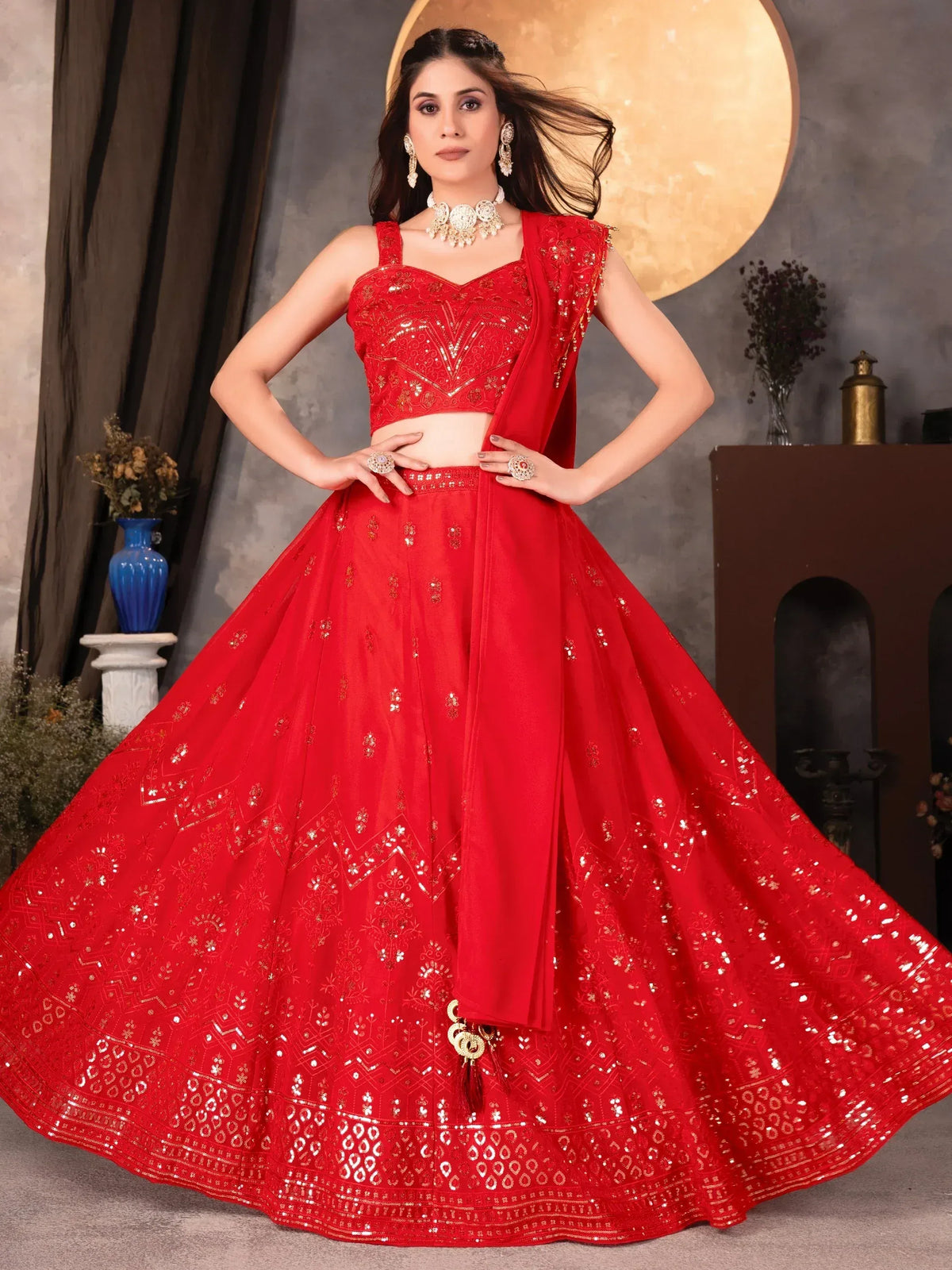 Red designer lehenga choli with gold embroidery and sequins, perfect for Indian ethnic wear occasions