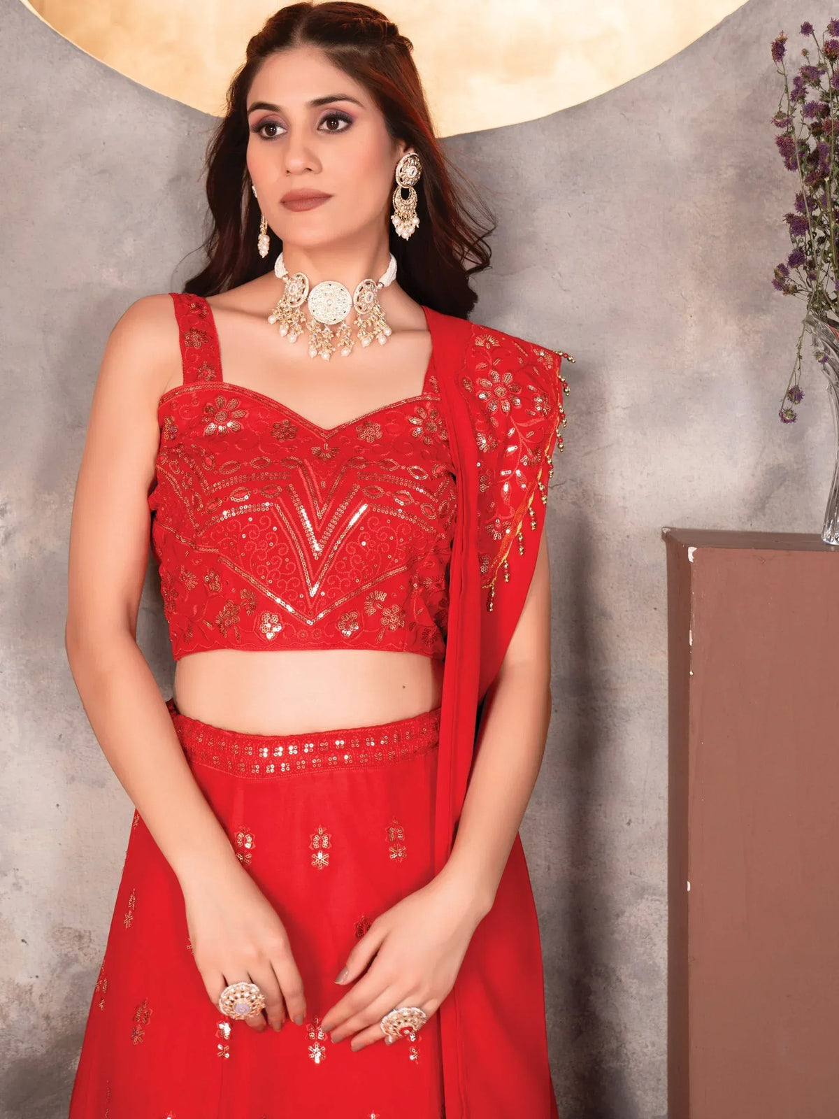 Red embroidered lehenga choli with sequin work, perfect for Indian ethnic wear and festive occasions