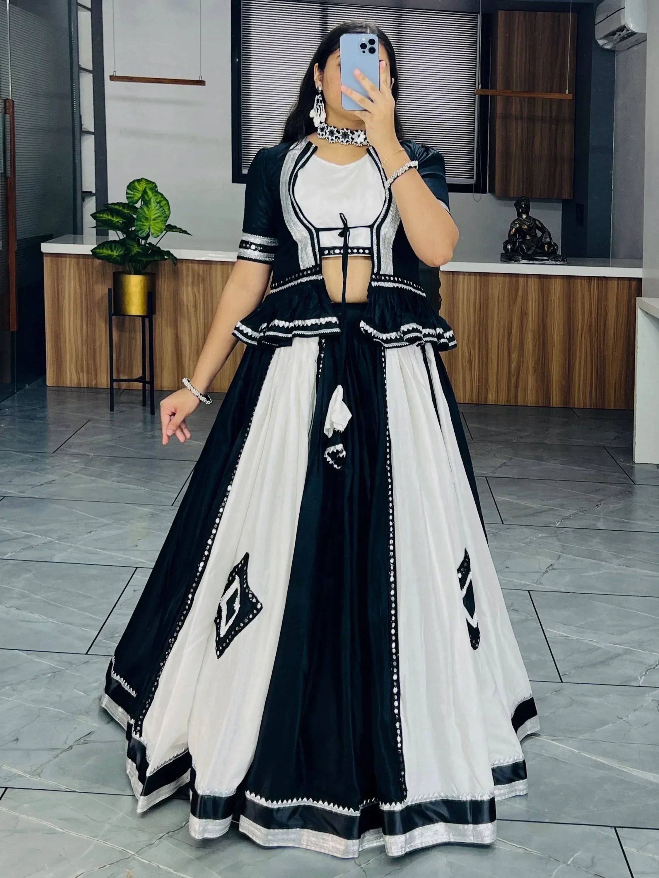 Black and white ethnic lehenga choli with mirror work, perfect for Indian festivals and weddings