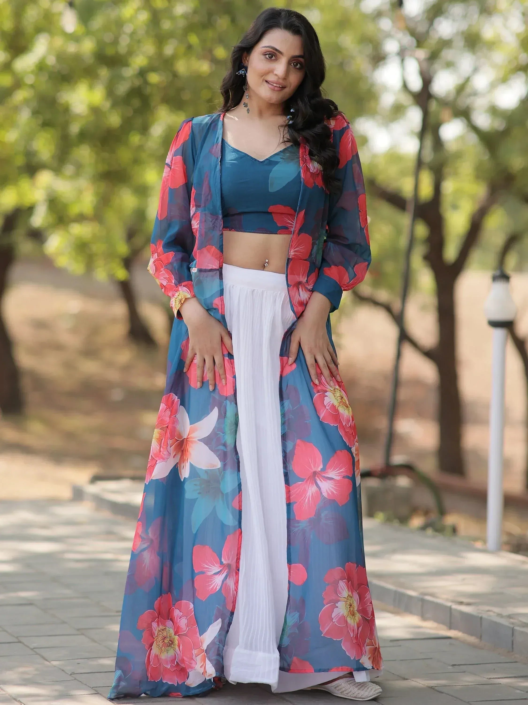 Woman in floral printed ethnic gown with white palazzo pants, perfect for Indian occasions