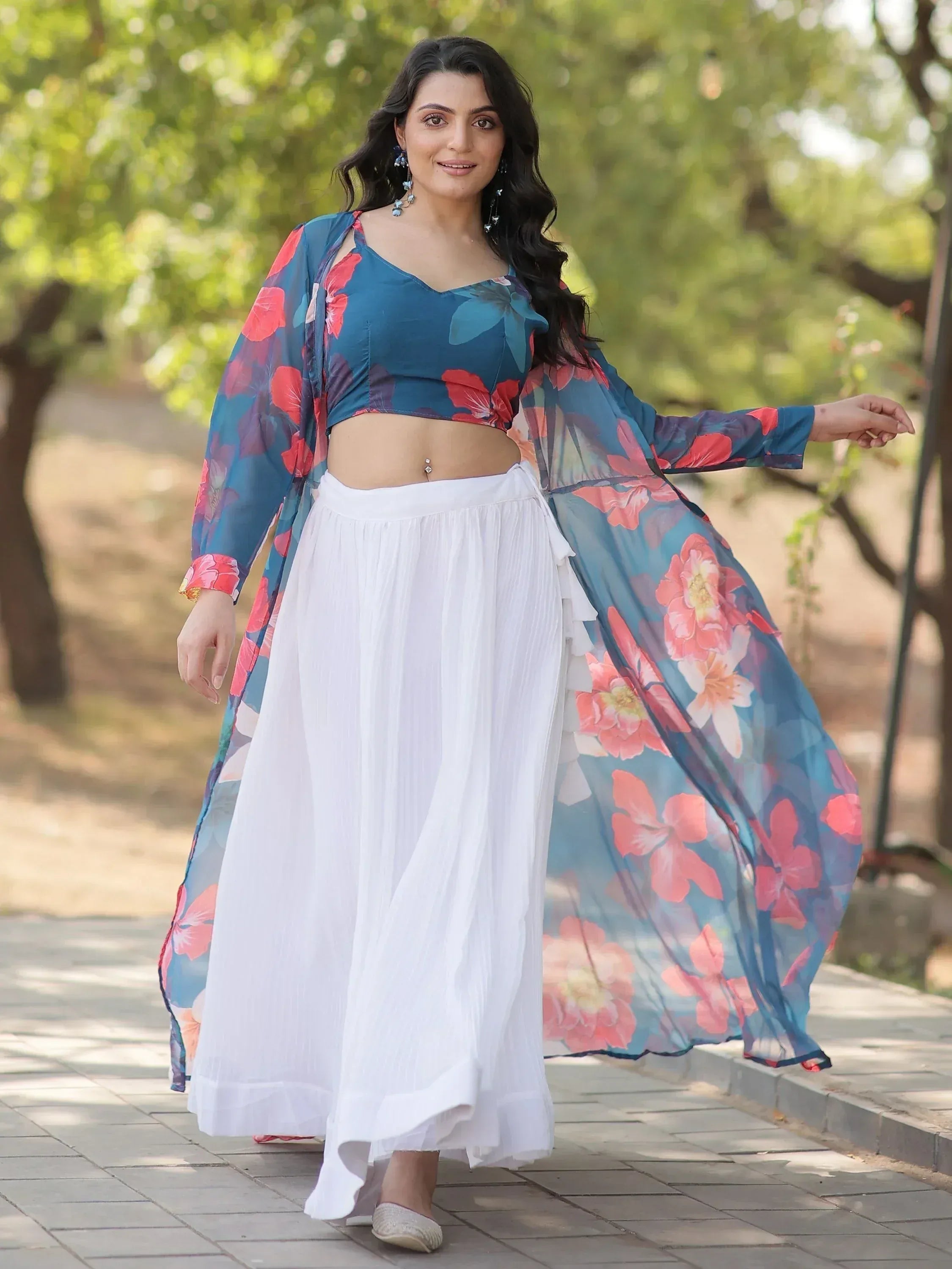 Floral print ethnic crop top with white palazzo pants and sheer drape, perfect for Indian fashion events
