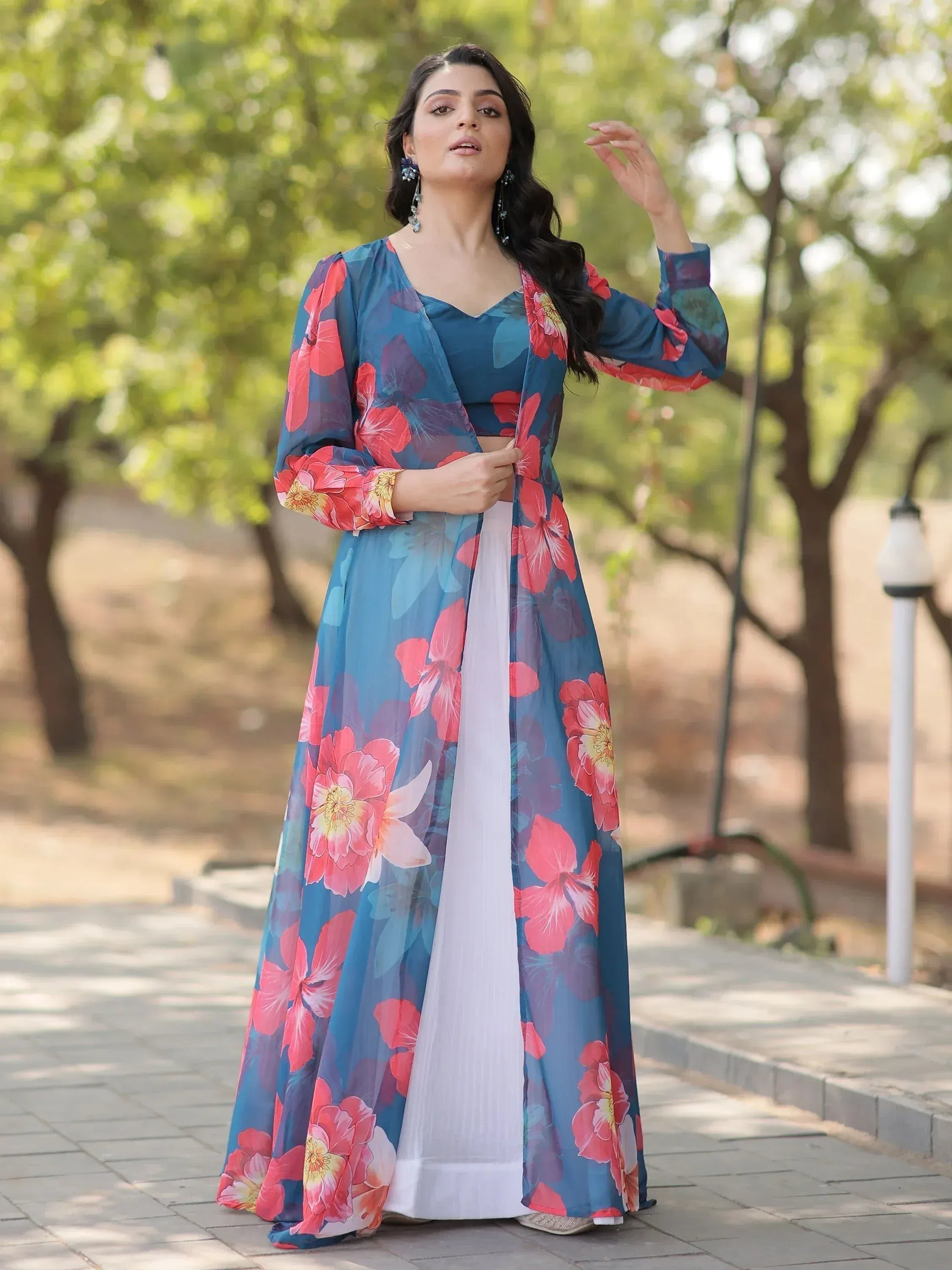 Woman in blue floral ethnic gown with white palazzo, perfect for Indian occasions