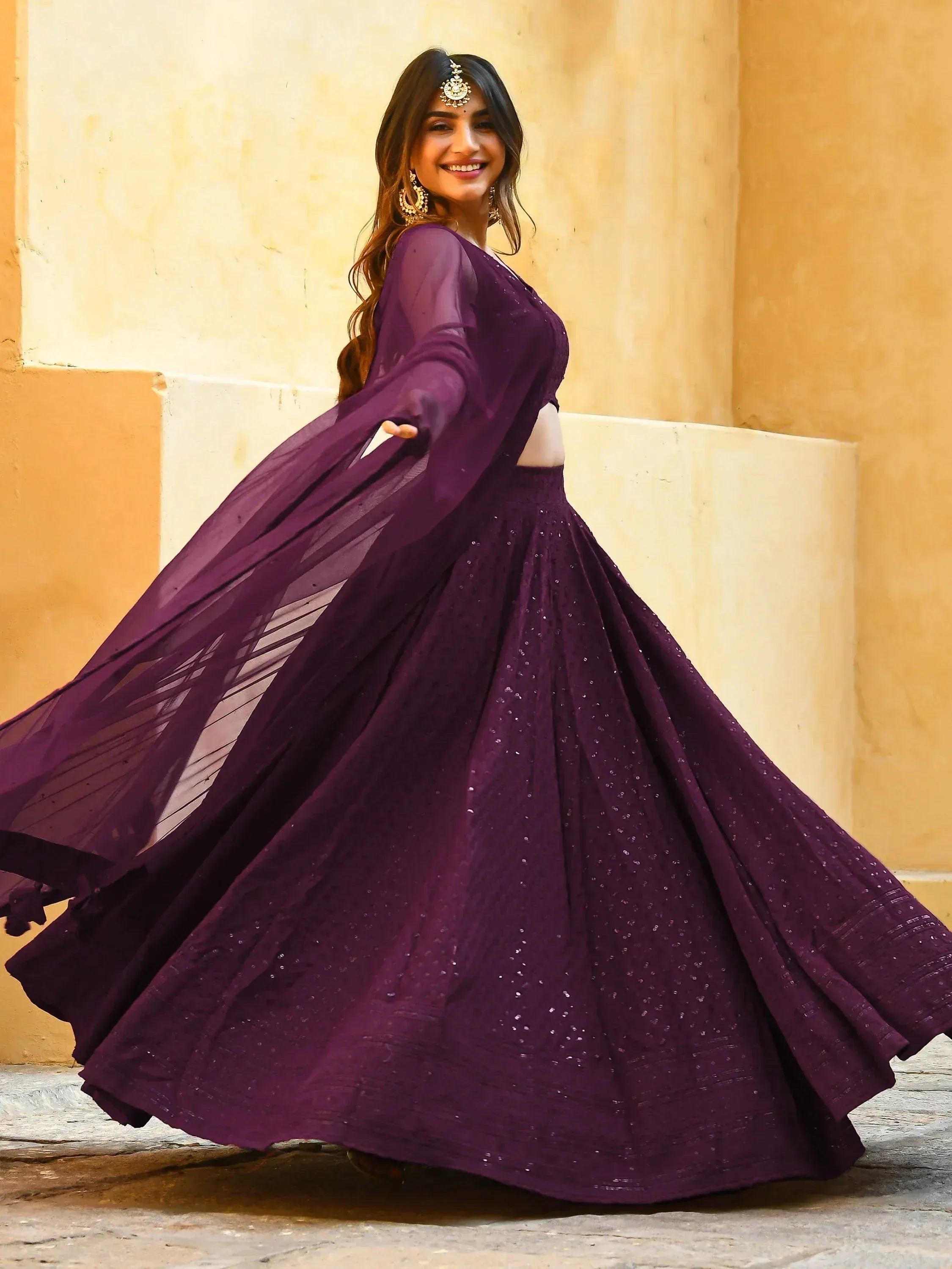 Elegant purple lehenga choli with sheer dupatta, perfect for Indian ethnic wear and festive occasions.
