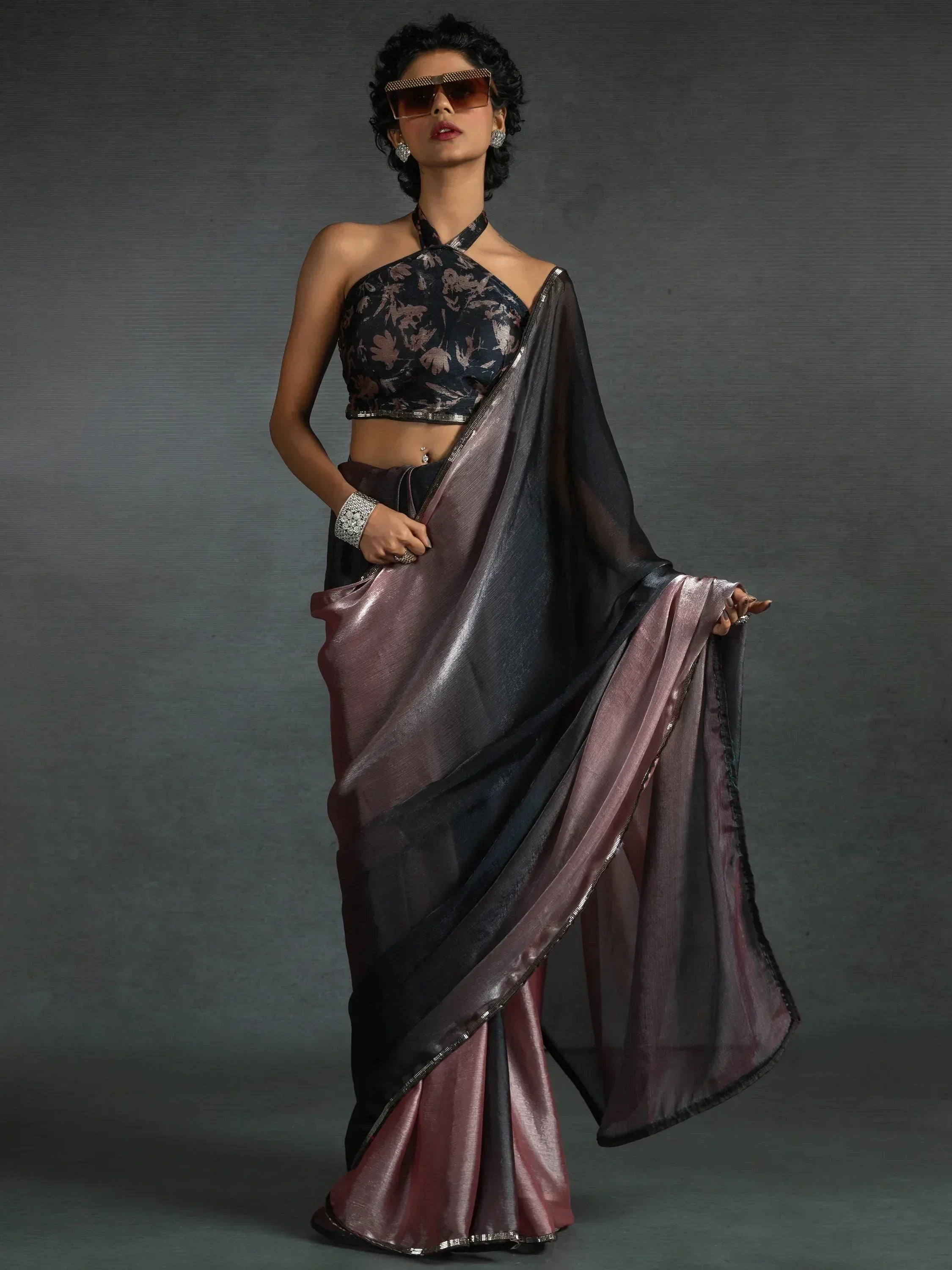 Stylish black and mauve saree with floral halter blouse, perfect for ethnic occasions