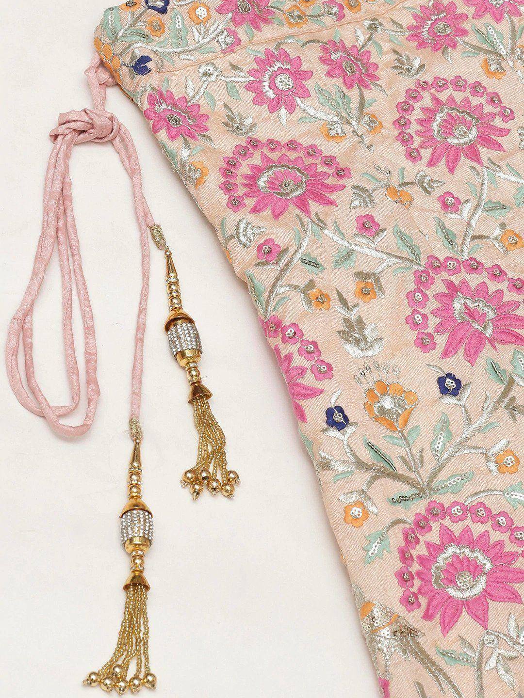Pink floral embroidered ethnic wear with gold tassels and beaded detailing