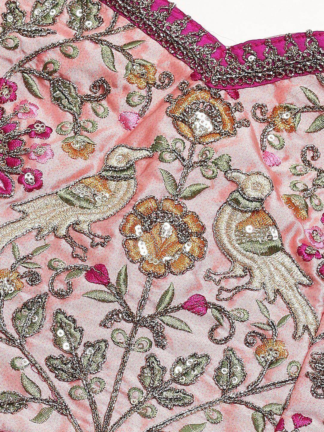 Pink ethnic wear with intricate bird and floral embroidery, sequins, and embellished neckline