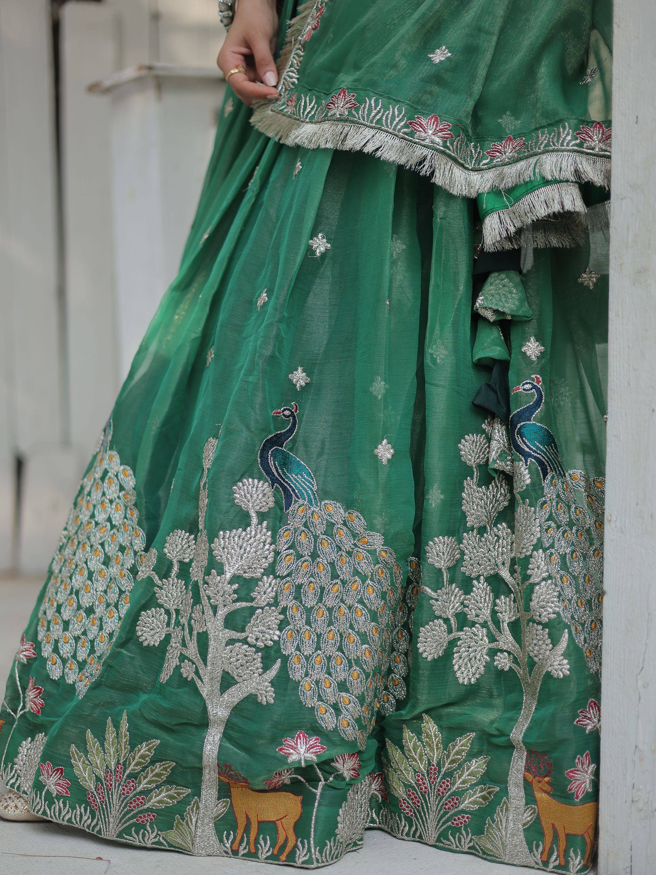 Emerald green lehenga with peacock and deer embroidery, perfect for Indian ethnic wear occasions.
