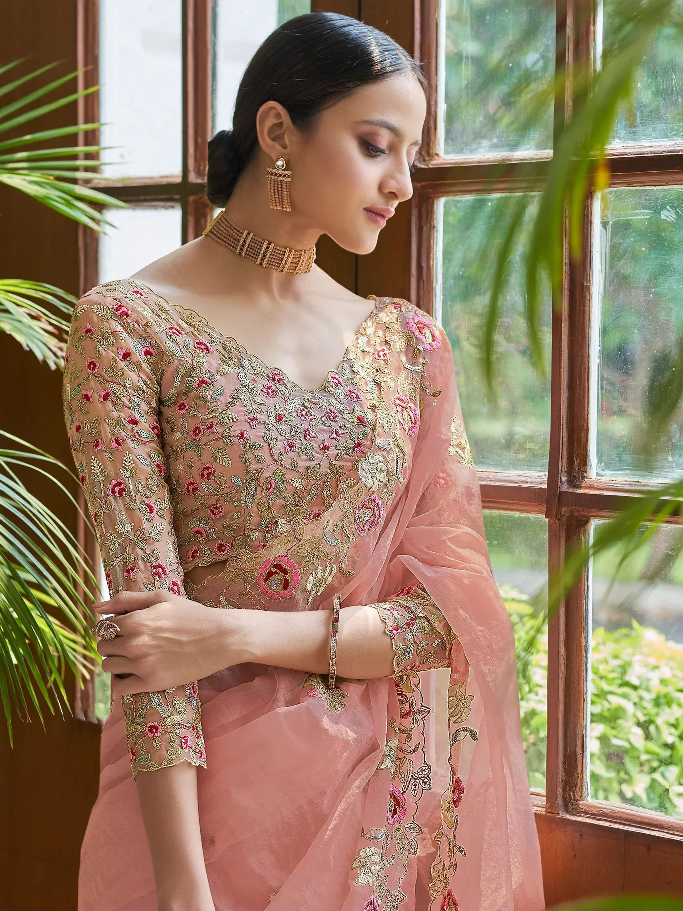 Pink embroidered saree with floral gold detailing, perfect for Indian ethnic wear occasions