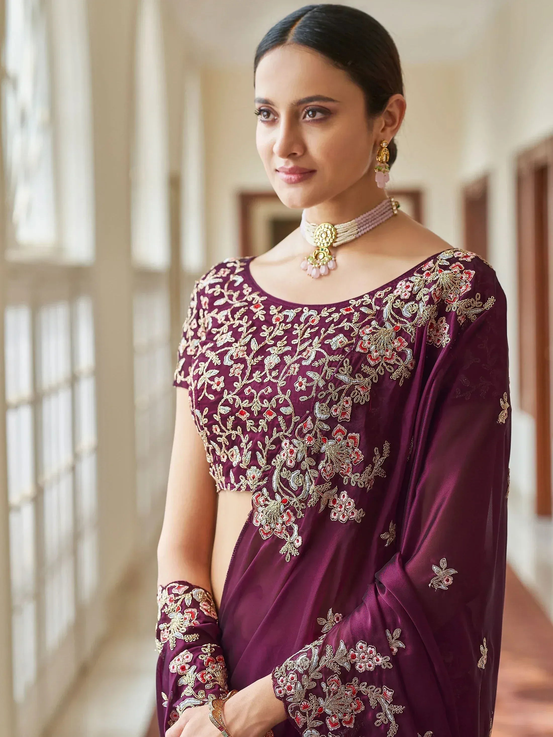 Elegant purple embroidered saree with floral zari work, perfect for Indian ethnic occasions