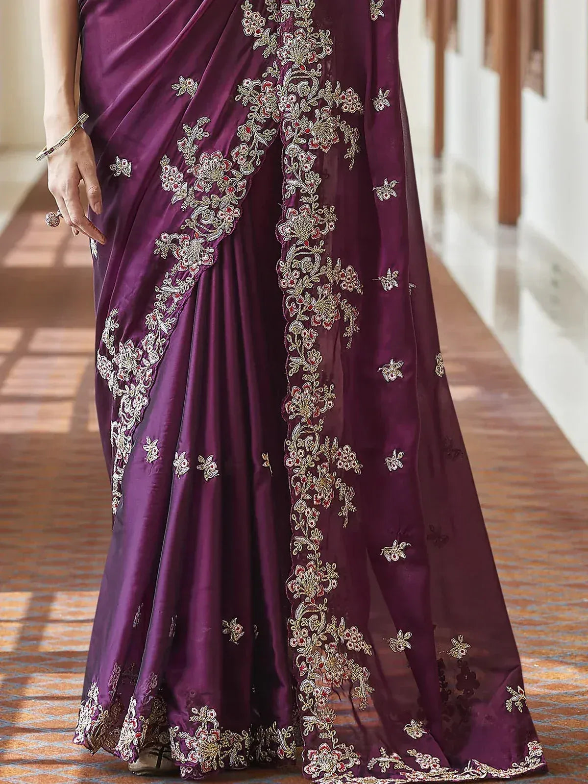 Purple embroidered saree with floral zari work, ideal for Indian ethnic occasions