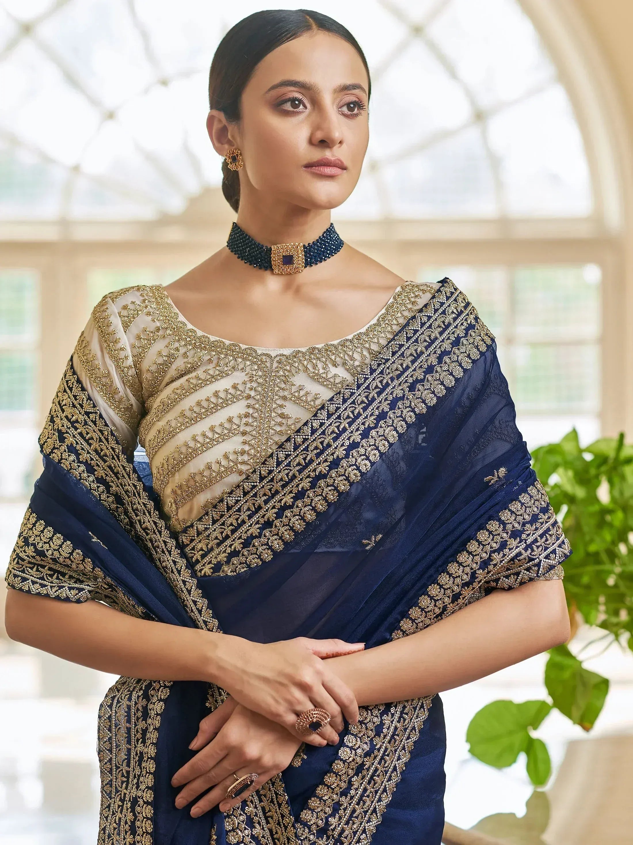 Elegant navy blue saree with gold embroidery, perfect for Indian ethnic wear occasions