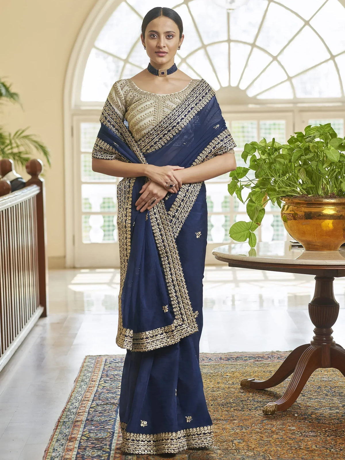 Navy blue designer saree with gold embroidery, perfect for Indian ethnic wear occasions