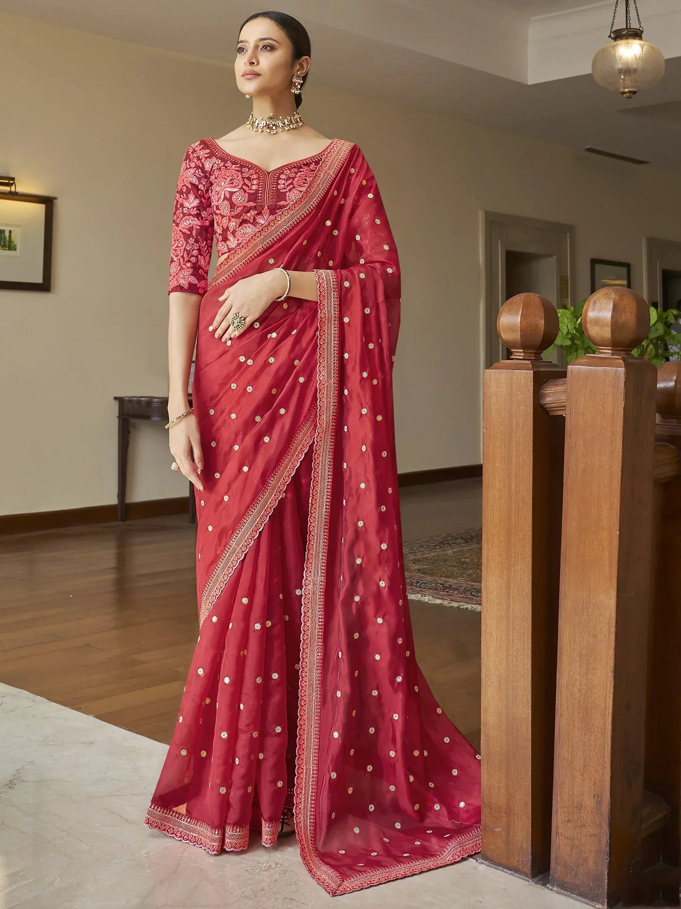 Elegant maroon saree with gold embroidery and floral blouse, perfect for Indian ethnic occasions