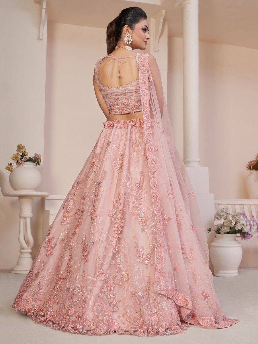 Pink floral embroidered lehenga choli with sheer dupatta, perfect for Indian weddings and festive occasions.
