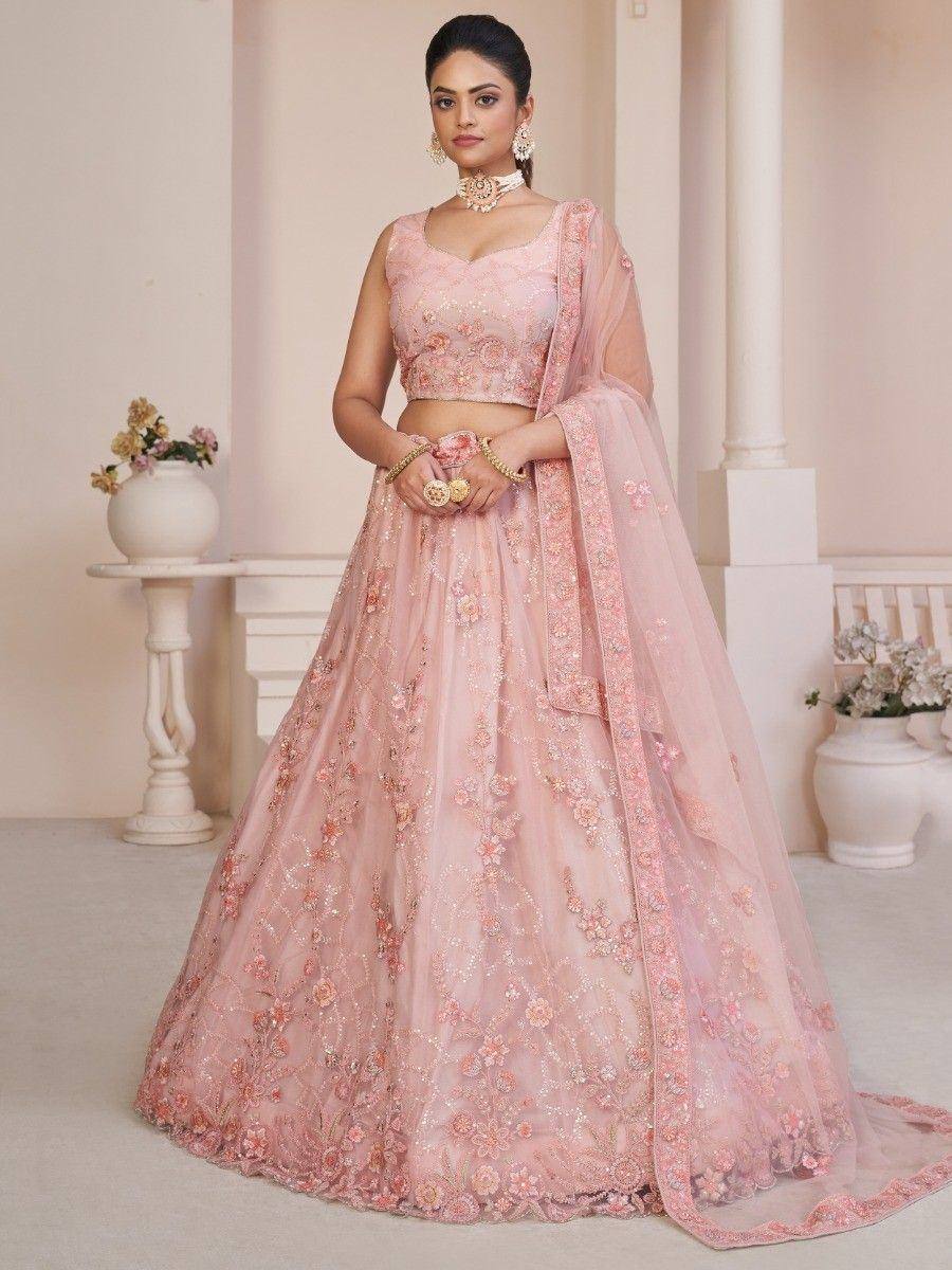 Pink floral embroidered lehenga choli with sheer dupatta, perfect for Indian weddings and festive occasions