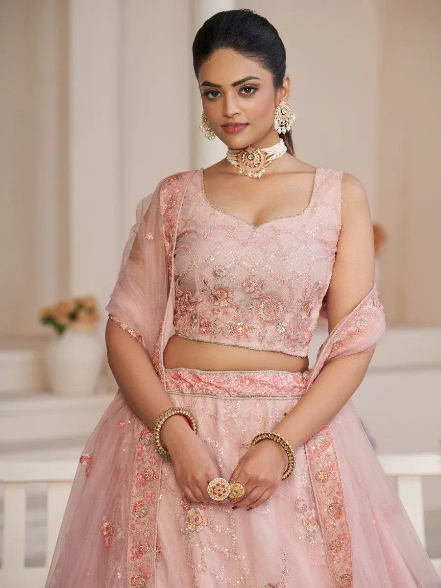 Pink floral embroidered lehenga choli with sheer dupatta, perfect for Indian weddings and festive occasions