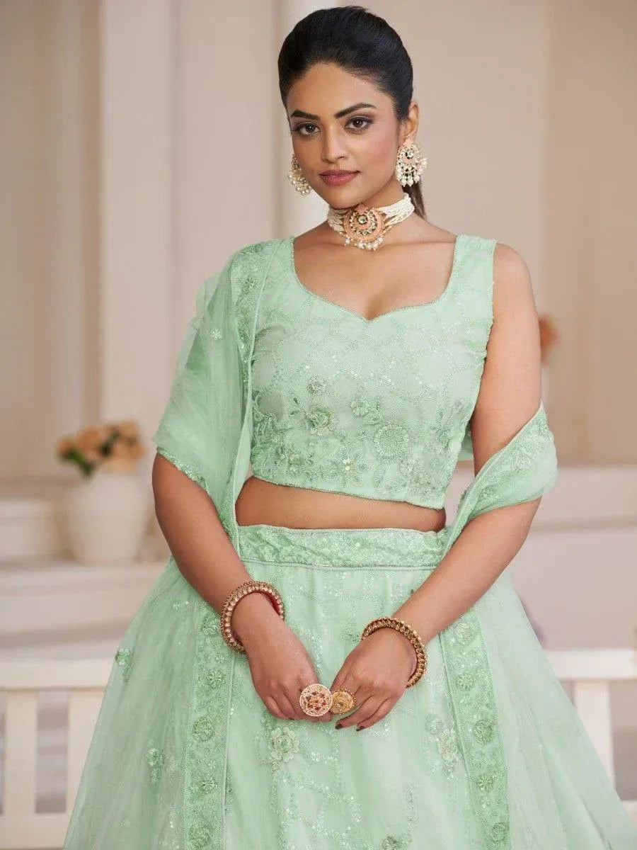 Mint green embroidered lehenga choli with sheer dupatta, perfect for Indian ethnic occasions