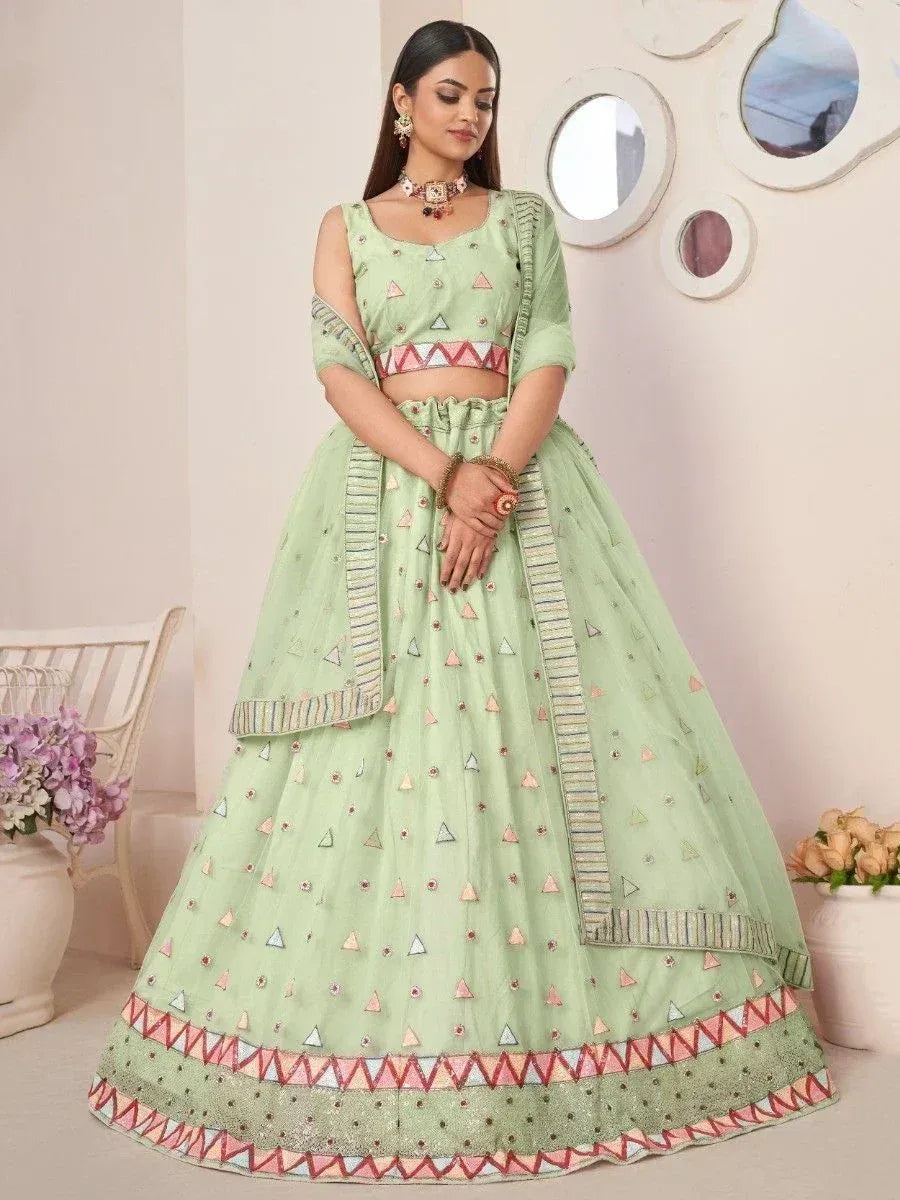 Mint green designer lehenga choli with geometric embroidery, perfect for Indian ethnic wear occasions