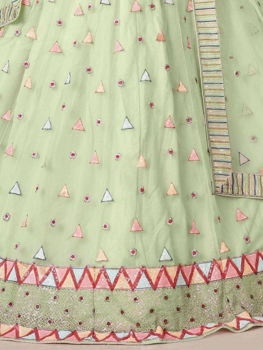 Mint green lehenga with triangle and floral embroidery, colorful border detailing