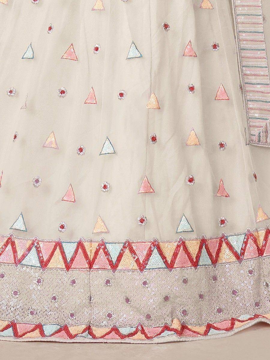 Beige ethnic gown with colorful triangle embroidery and sequin border, perfect for Indian occasions